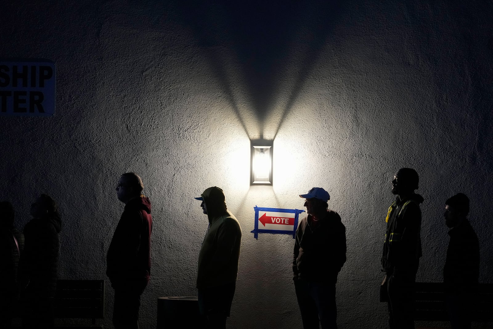 Voters stand in line outside a polling place at Madison Church, Tuesday, Nov. 5, 2024, in Phoenix, Ariz. (AP Photo/Matt York)