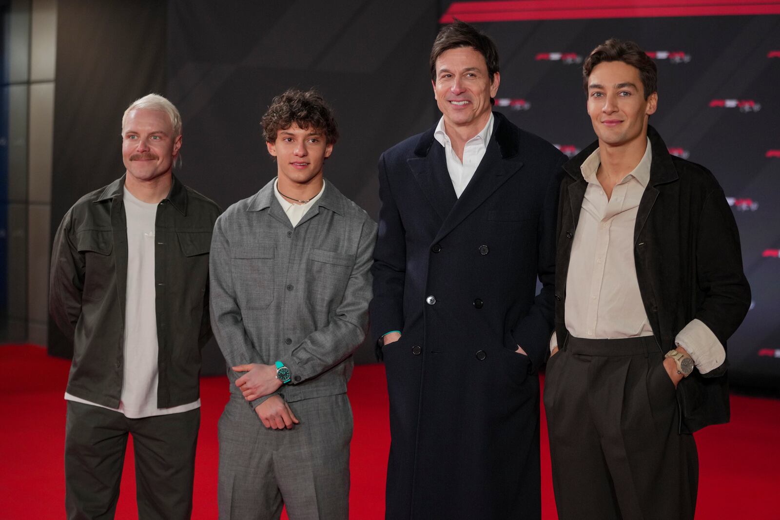 From left: Mercedes reserve driver Valeri Bottas of Finland, Mercedes driver Andrea Kimi Antonelli of Italy, Mercedes team principal Toto Wolff, and Mercedes driver George Russell of Britain pose for cameras as they arrive to the F1 75 Live event at the O2 arena in London, Tuesday, Feb. 18, 2025. (AP Photo/Kin Cheung)