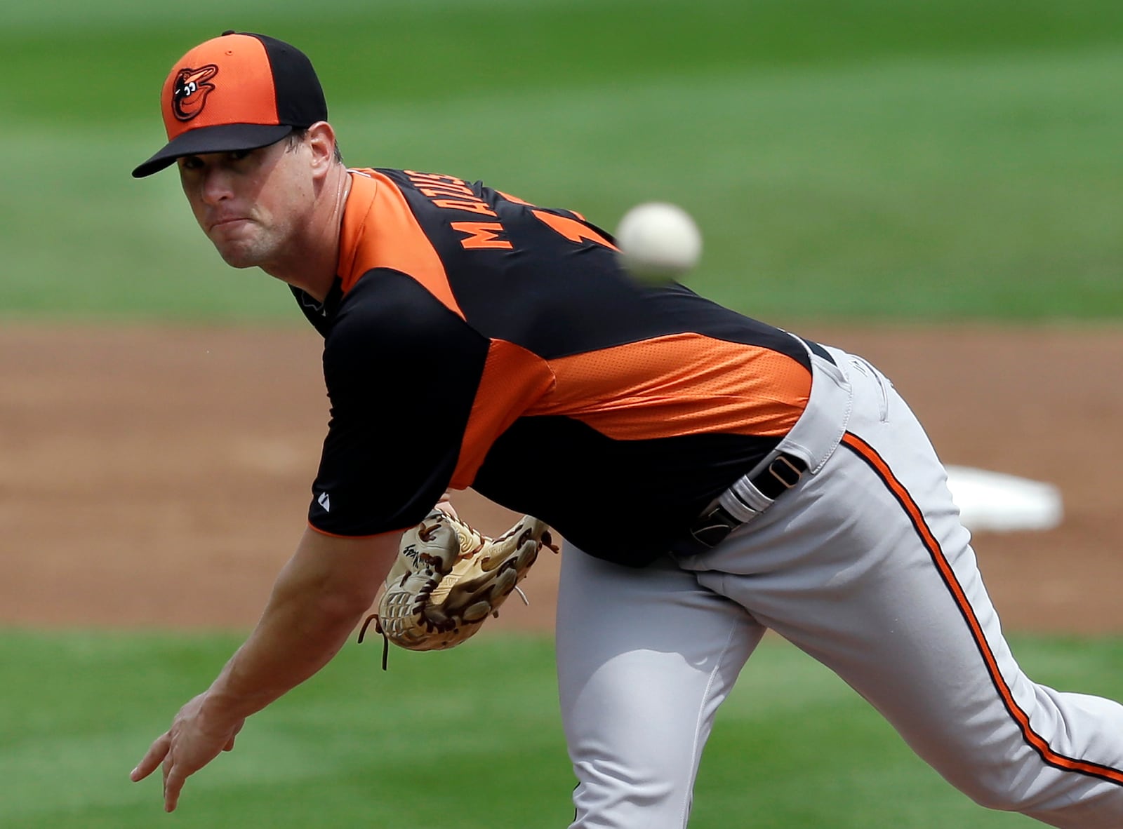 FILE - Baltimore Orioles starting pitcher Brian Matusz (17) delivers to the Boston Red Sox in the first inning of an exhibition spring training baseball game in Fort Myers, Fla., Tuesday, March 19, 2013. (AP Photo/Elise Amendola, File)