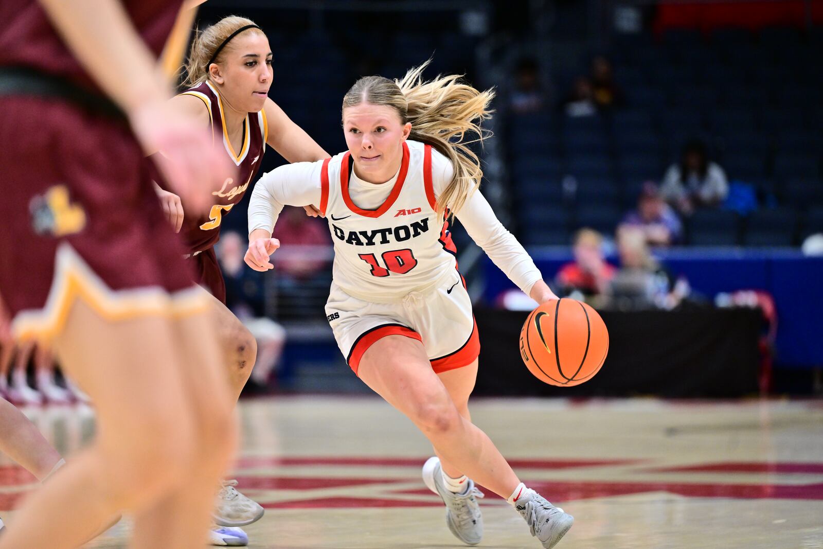 Dayton's Ivy Wolf drives past a Loyola Chicago defender during Saturday's game at UD Arena. Erik Schelkun/UD Athletics