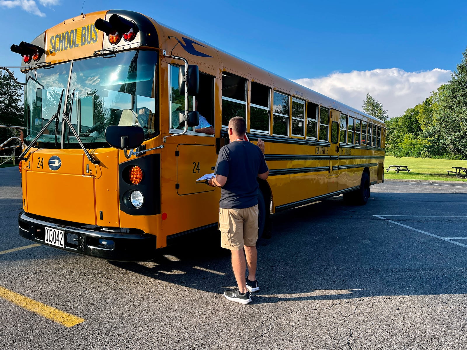 Bus drivers in Centerville Schools inspect a bus before beginning work. Contributed.