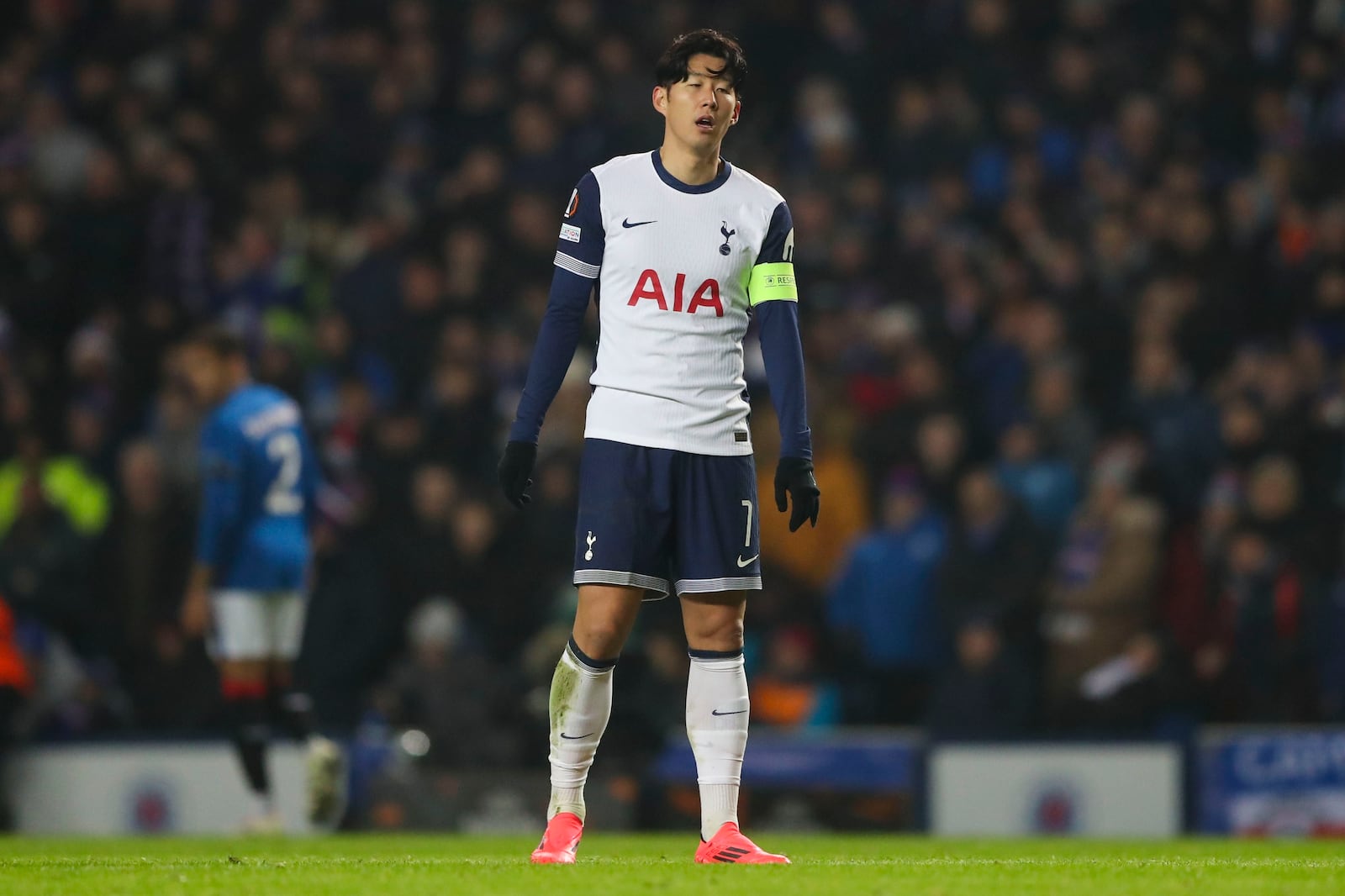 Tottenham's Son Heung-min reacts after Rangers' Hamza Igamane scored the opening goal during the Europa League opening phase soccer match between Glasgow Rangers and Tottenham Hotspur at Ibrox stadium in Glasgow, Thursday, Dec. 12, 2024. (AP Photo/Scott Heppell)