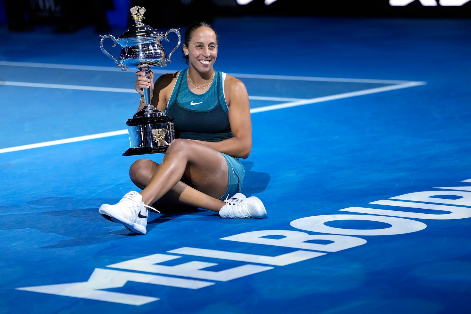 Madison Keys of the U.S. holds the Daphne Akhurst Memorial Cup after defeating Aryna Sabalenka of Belarus in the women's singles final at the Australian Open tennis championship in Melbourne, Australia, Saturday, Jan. 25, 2025. (AP Photo/Ng Han Guan)