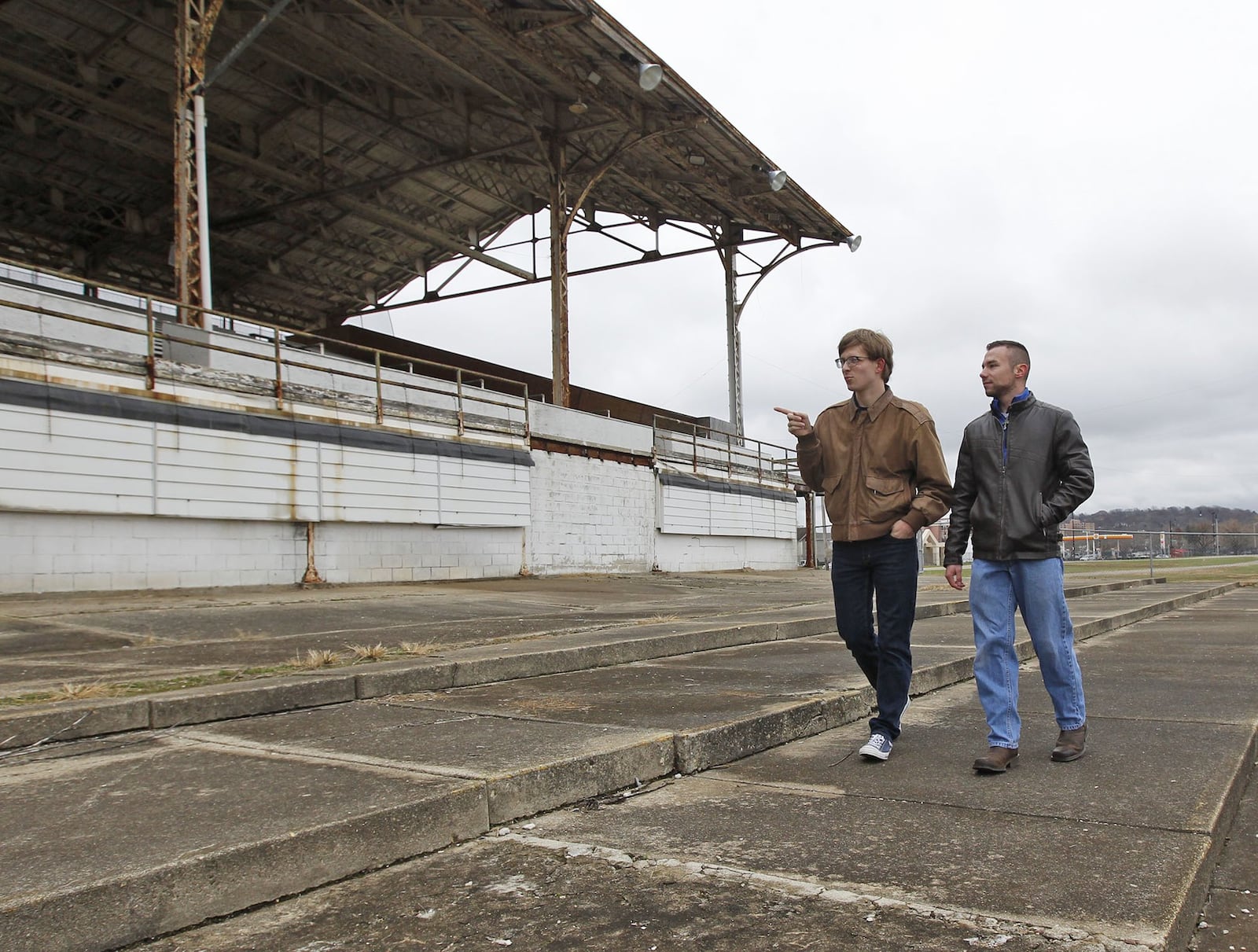 Students from Sinclair Community College civil engineering technologies program, Zachary Osterday, left, and Christopher Hess, talk about surveying work they completed at onMain - Dayton’s Imagination District during a two-semester lab project. TY GREENLEES / STAFF