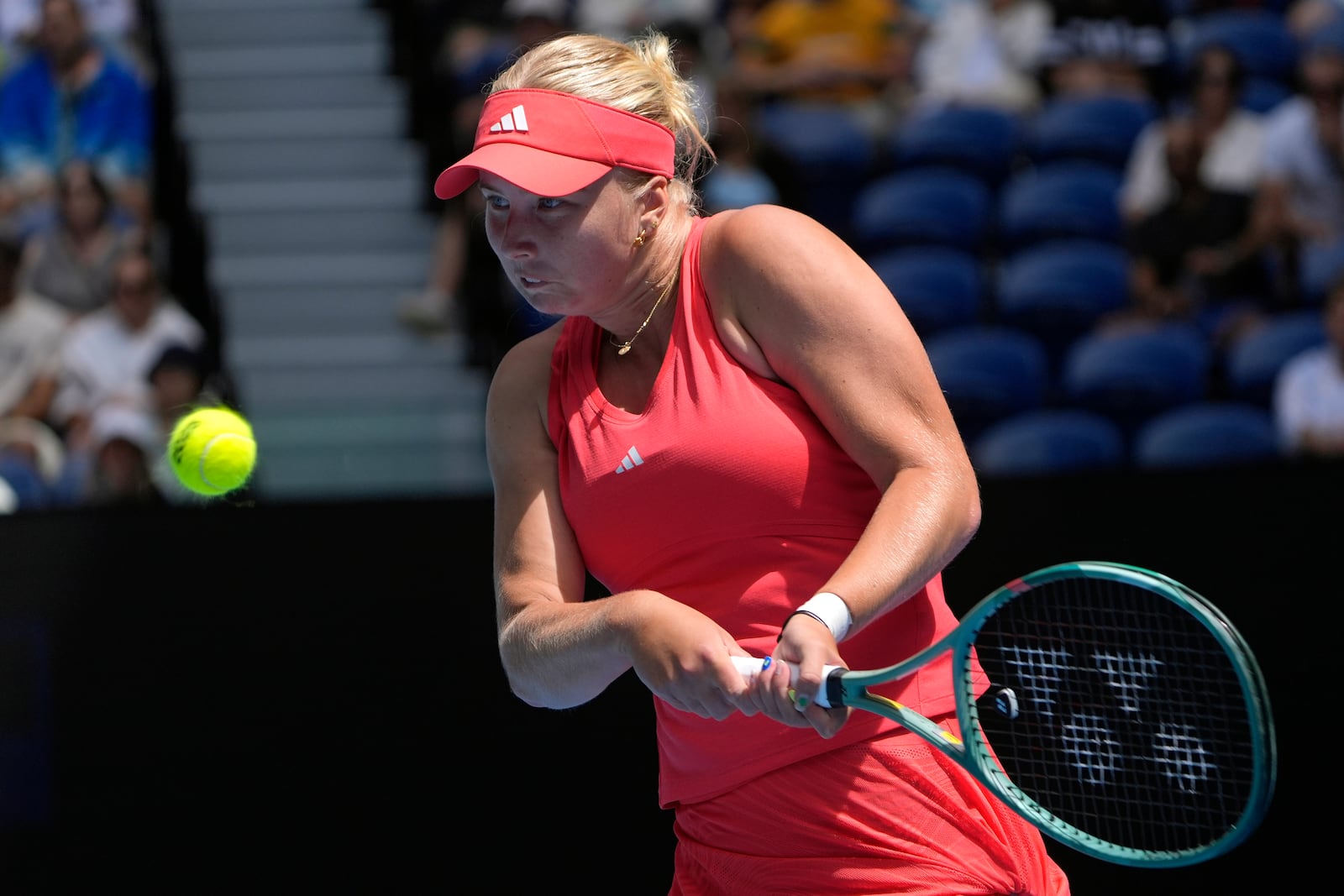 Clara Tauson of Denmark plays a backhand return to Aryna Sabalenka of Belarus during their third round match at the Australian Open tennis championship in Melbourne, Australia, Friday, Jan. 17, 2025. (AP Photo/Asanka Brendon Ratnayake)