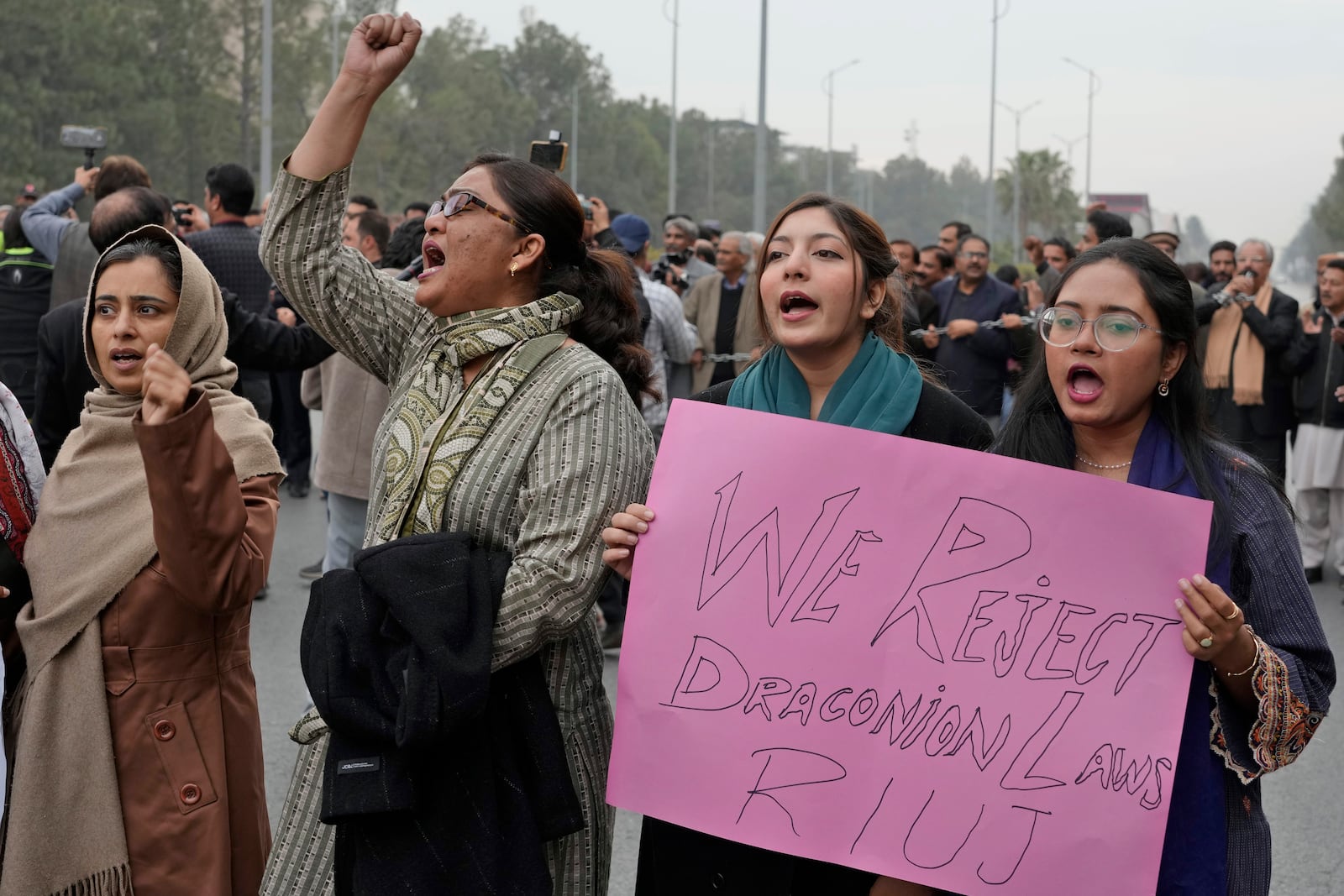 Journalists chant slogans during a rally in Islamabad, Pakistan, Tuesday, Jan. 28, 2025, to condemn a controversial 'Prevention of Electronic Crimes Act' bill passed by parliament that critics argue is designed to suppress freedom of speech. (AP Photo/Anjum Naveed)