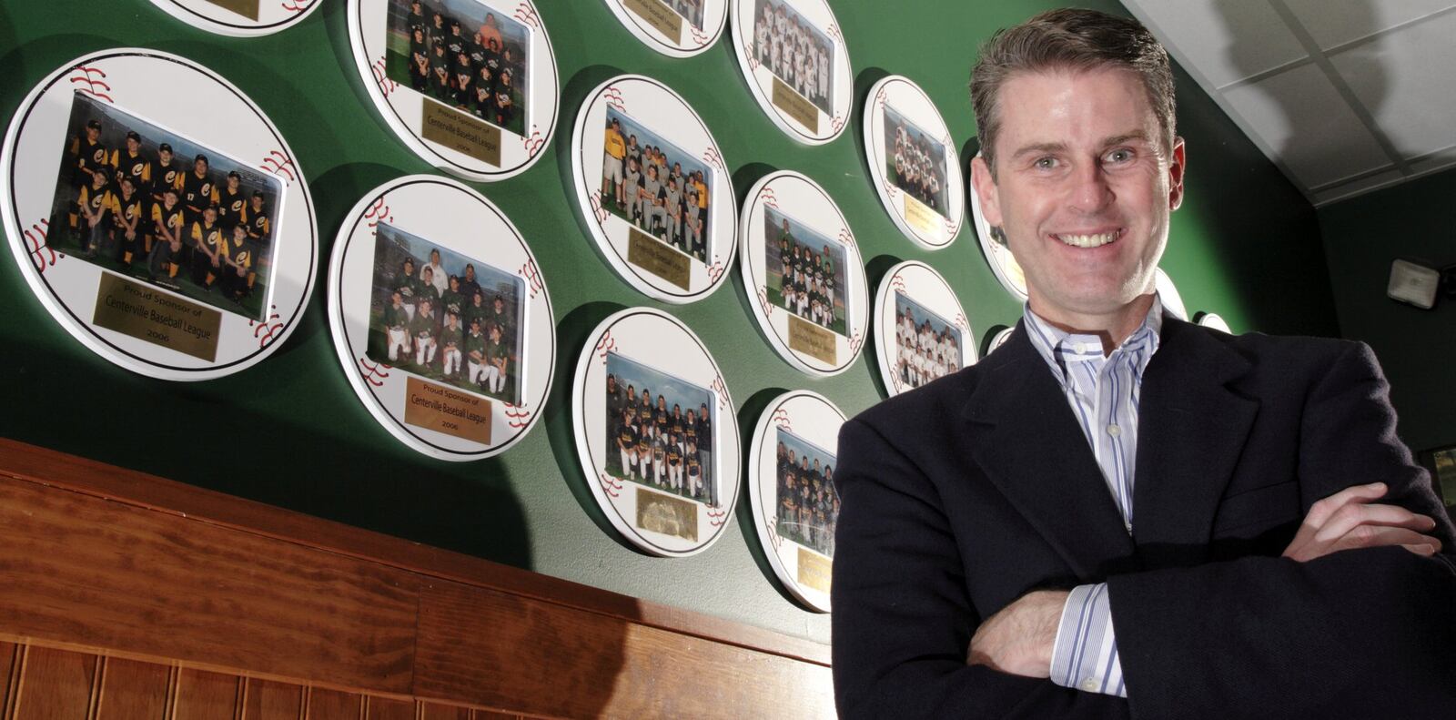 Bill DeFries, owner of the Centerville Beef ‘O’ Brady’s, surrounded by memorabilia of local teams, Tuesday, November 20, 2007. He plans to run for Montgomery County commissioner.