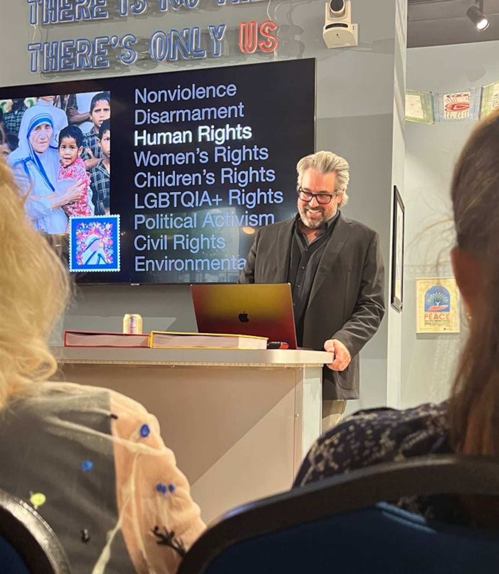 Johnny Selman of Brooklyn, New York, unveils the Project Peace Post exhibit at the International Peace Museum on Friday, Sept. 6. CONTRIBUTED