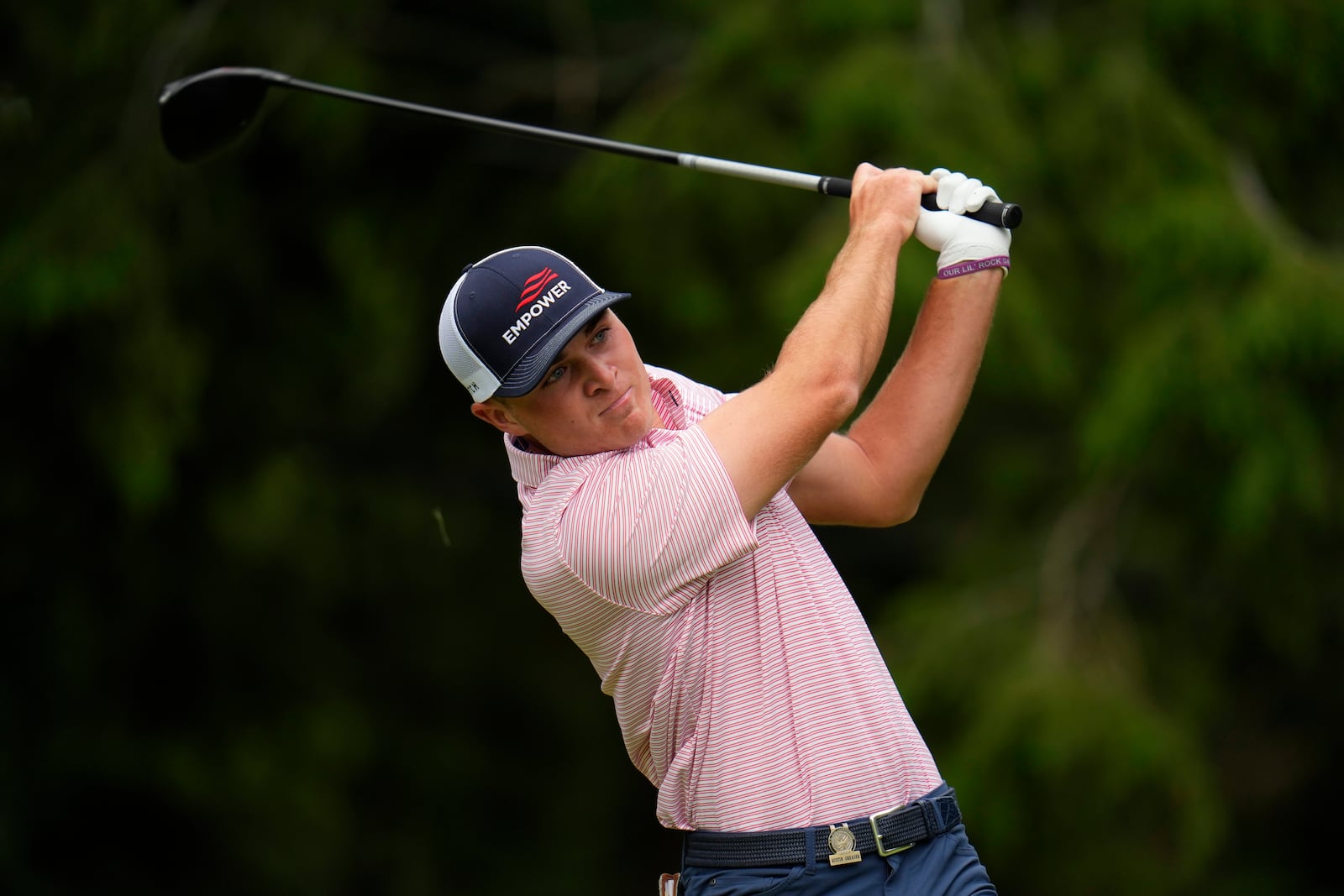 Austin Greaser watches his shot on the 17th hole during the first round of the U.S. Open golf tournament at The Country Club, Thursday, June 16, 2022, in Brookline, Mass. (AP Photo/Julio Cortez)