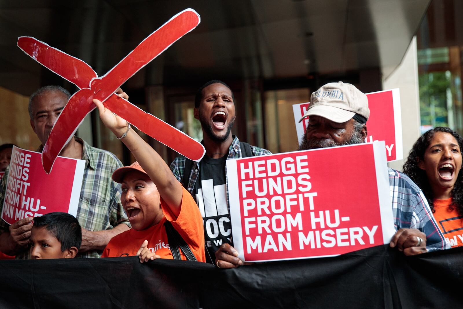 Activists rally during a protest against the price of EpiPens, outside the office of hedge fund manager John Paulson, August 30, 2016 in New York City. Paulson’s hedge fund is a major investor in Mylan, the pharmaceutical company that has raised the price of EpiPens over 400 percent in the past 8 years. (Photo by Drew Angerer/Getty Images)