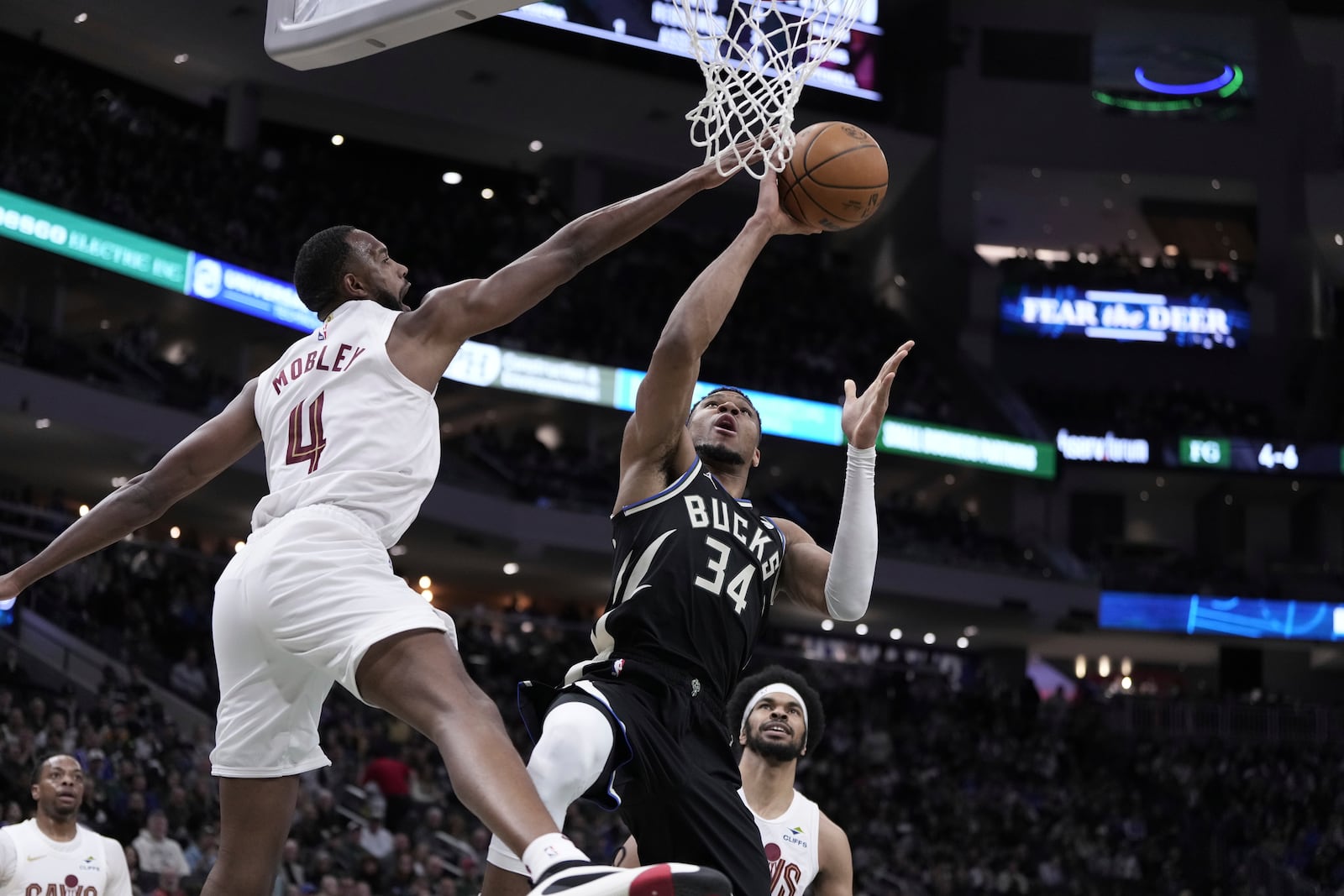 Milwaukee Bucks' Giannis Antetokounmpo shoots past Cleveland Cavaliers' Evan Mobley during the first half of an NBA basketball game Sunday, Mar. 9, 2025, in Milwaukee. (AP Photo/Morry Gash)