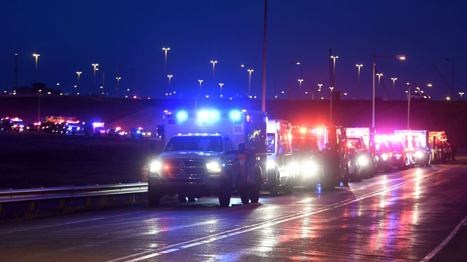 A procession of more than 100 emergency vehicles honors fallen Colorado paramedic Paul Cary in Denver on Sunday, May 3, 2020. Cary, 66, died Thursday, April 30, of coronavirus complications after volunteering to help combat the pandemic in New York City. (Helen H. Richardson/The Denver Post via AP)