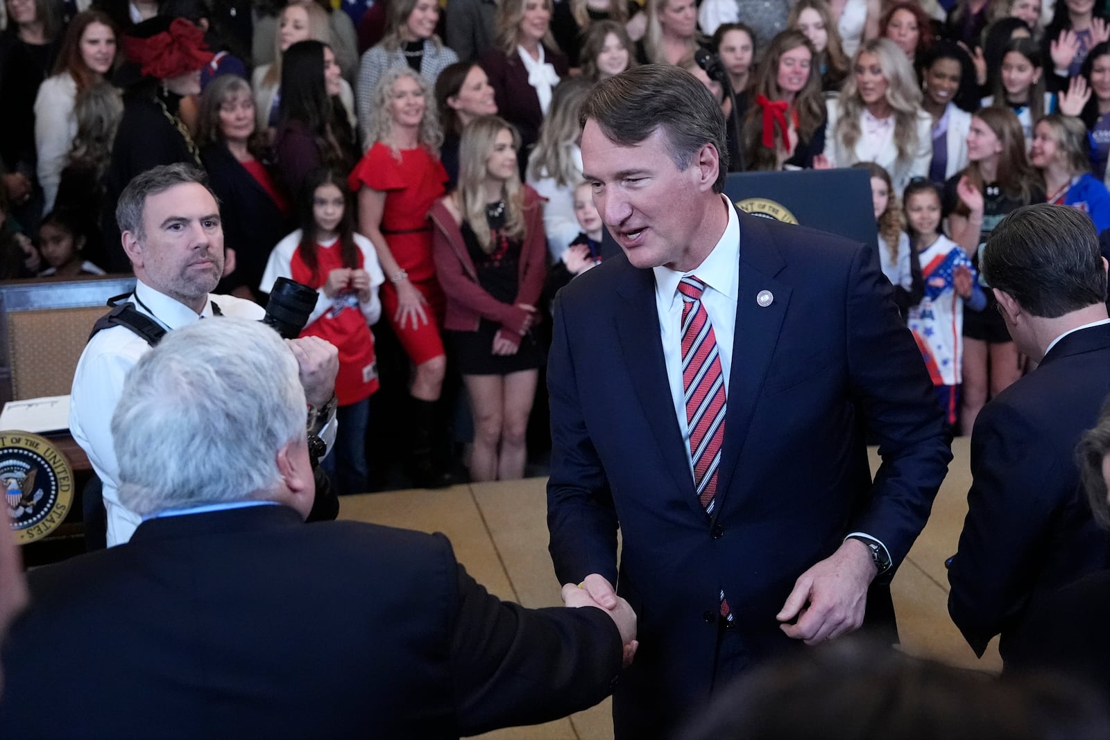 Virginia Gov. Glenn Youngkin prepares to leave after President Donald Trump signed an executive order barring transgender female athletes from competing in women's or girls' sporting events, in the East Room of the White House, Wednesday, Feb. 5, 2025, in Washington. (AP Photo/Alex Brandon)