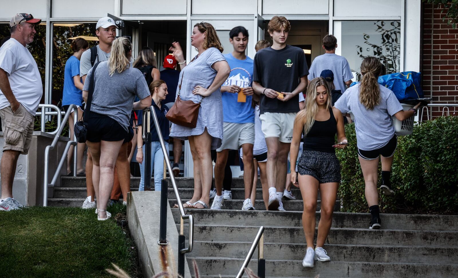 The University of Dayton held the freshmen "move in day" at the university Friday August 19, 2022. Hundreds of student filled the walkways and steps moving their items in their dorm rooms. JIM NOELKER/STAFF