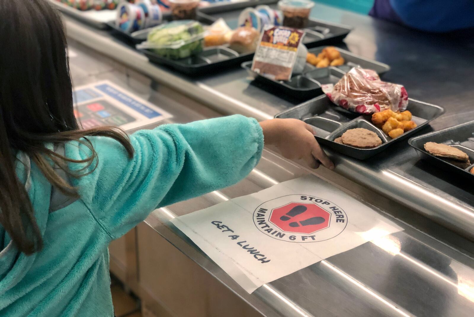 A second grader at Cline Elementary in Centerville gets served lunch. Contributed from Centerville Schools.