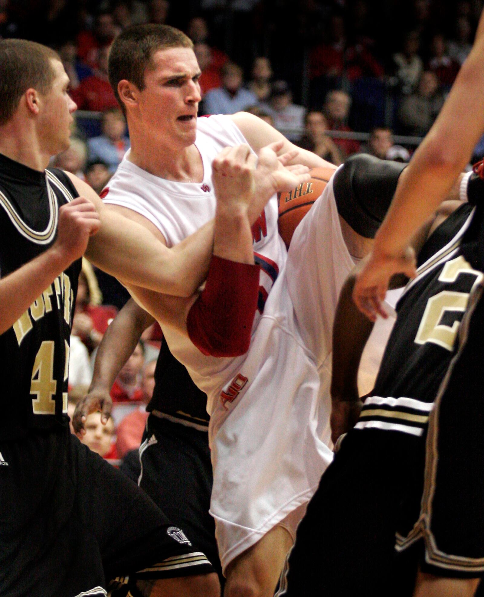 Dayton’s Kurt Huelsman pulls down a rebound and picks up a foul against Wofford College at UD Arena on Nov. 16, 2008.