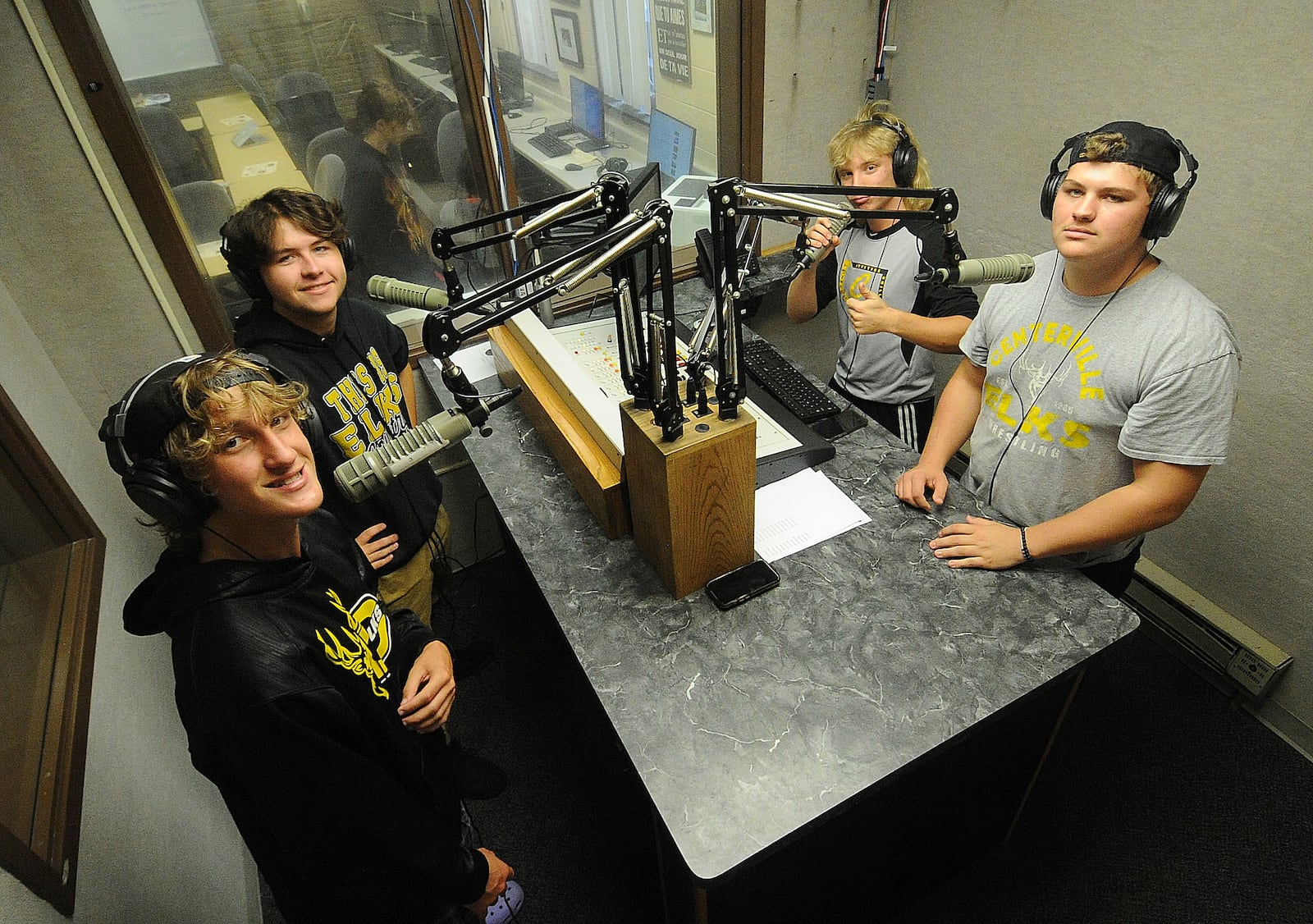 Centerville High School students, left to right, Aidan Thompson, Evan Gross, Dalton Mathews and Carter Korchinski work at the school's radio station Thursday Sept. 22, 2022. MARSHALL GORBY\STAFF