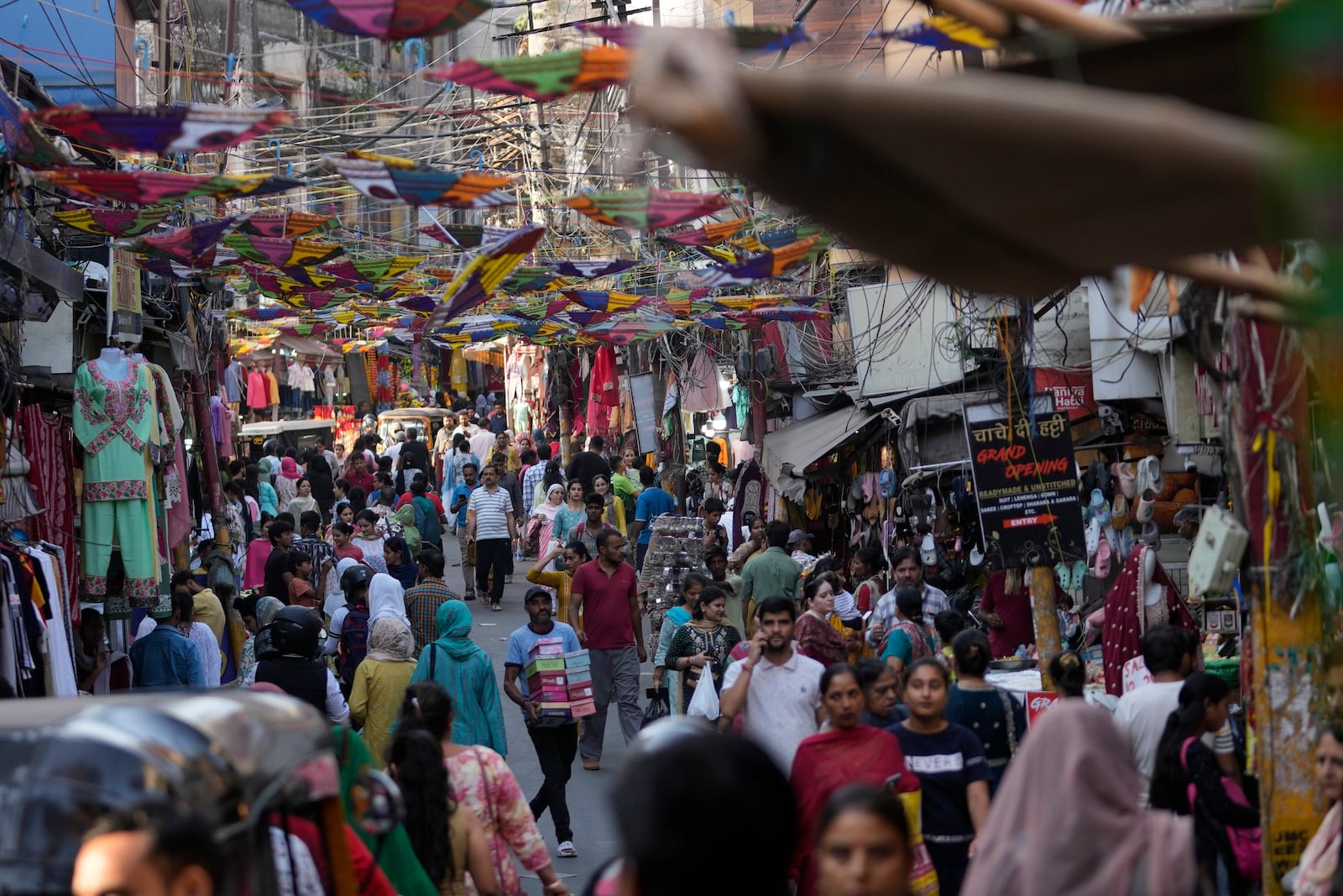 People crowd a market area on the eve of Diwali, the Hindu festival of lights, in Jammu, India, Wednesday, Oct.30,2024. Diwali is one of Hinduism's most important festivals, dedicated to the worship of the goddess of wealth Lakshmi. (AP Photo/Channi Anand)