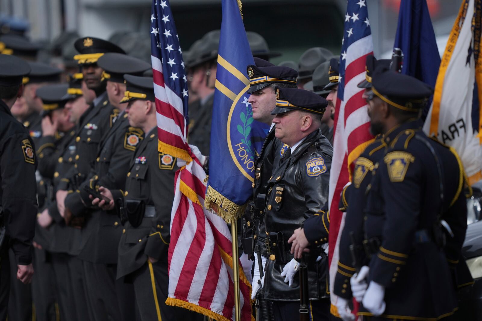 Officers wait before the start of West York Borough Police Officer Andrew Duarte's funeral at Living Word Community Church, in Red Lion, Pa., Friday, Feb. 28, 2025. (AP Photo/Matt Rourke)