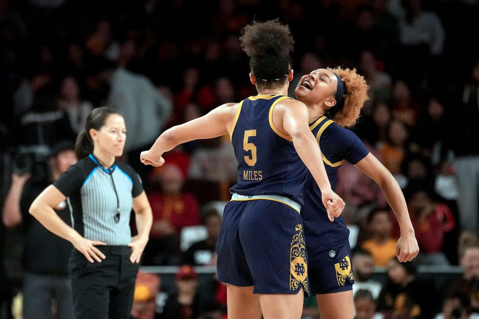 Notre Dame guards Olivia Miles (5) and Hannah Hidalgo celebrate during the second half of an NCAA college basketball game against Southern California, Saturday, Nov. 23, 2024 in Los Angeles. (AP Photo/Eric Thayer)