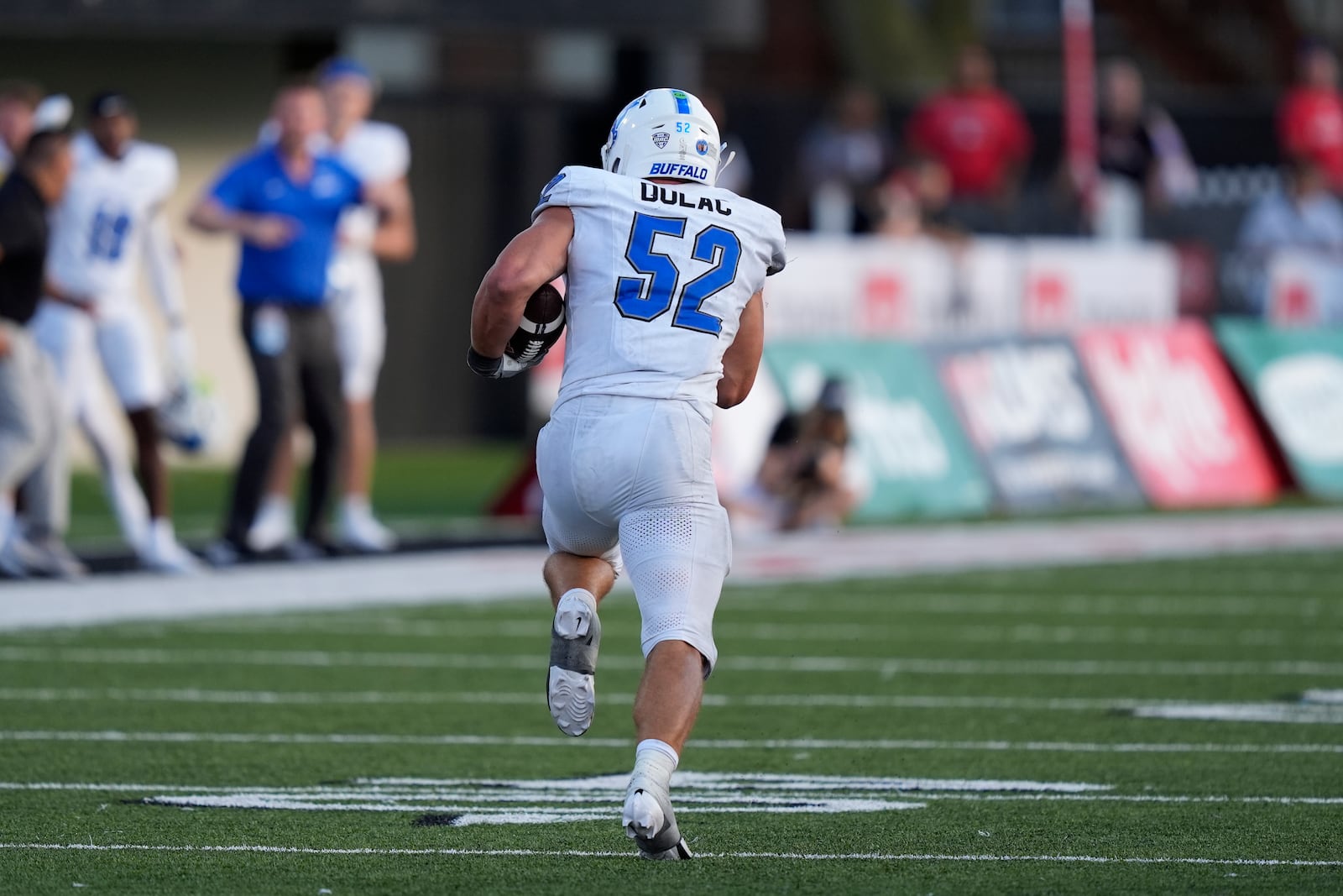 Buffalo linebacker Shaun Dolac returns his interception of a pass by Northern Illinois quarterback Ethan Hampton during the second half of an NCAA college football game Saturday, Sept. 21, 2024, in DeKalb, Ill. (AP Photo/Charles Rex Arbogast)