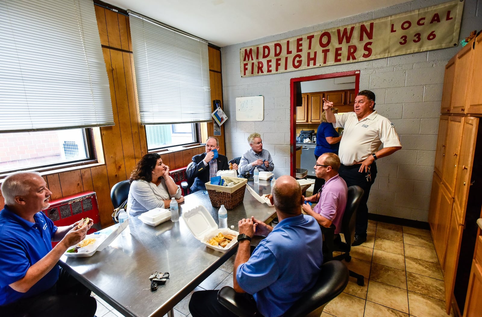 Middletown Fire Chief Paul Lolli, right, talks to city council members and city officials last year inside Station 81 on North Clinton Street. They took a bus tour of the four fire stations in operation in Middletown and one of Fairfield Township’s more modern stations. Lolli has been dignosed with liver cancer and is awaiting a transplant. NICK GRAHAM/STAFF