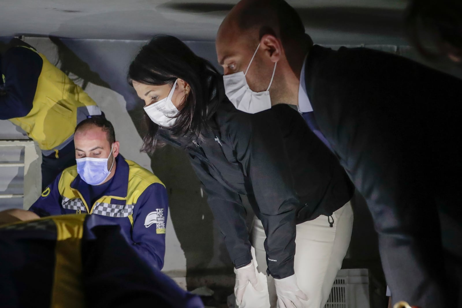 German and French Foreign Affairs ministers Annalena Baerbock, center left,, and Jean-Noel Barrot, right, listen to representatives of the White Helmets during a guided visit to the infamous Saydnaya military prison north of Damascus, Syria, Friday Jan. 3, 2023.(AP Photo/Omar Sanadiki).