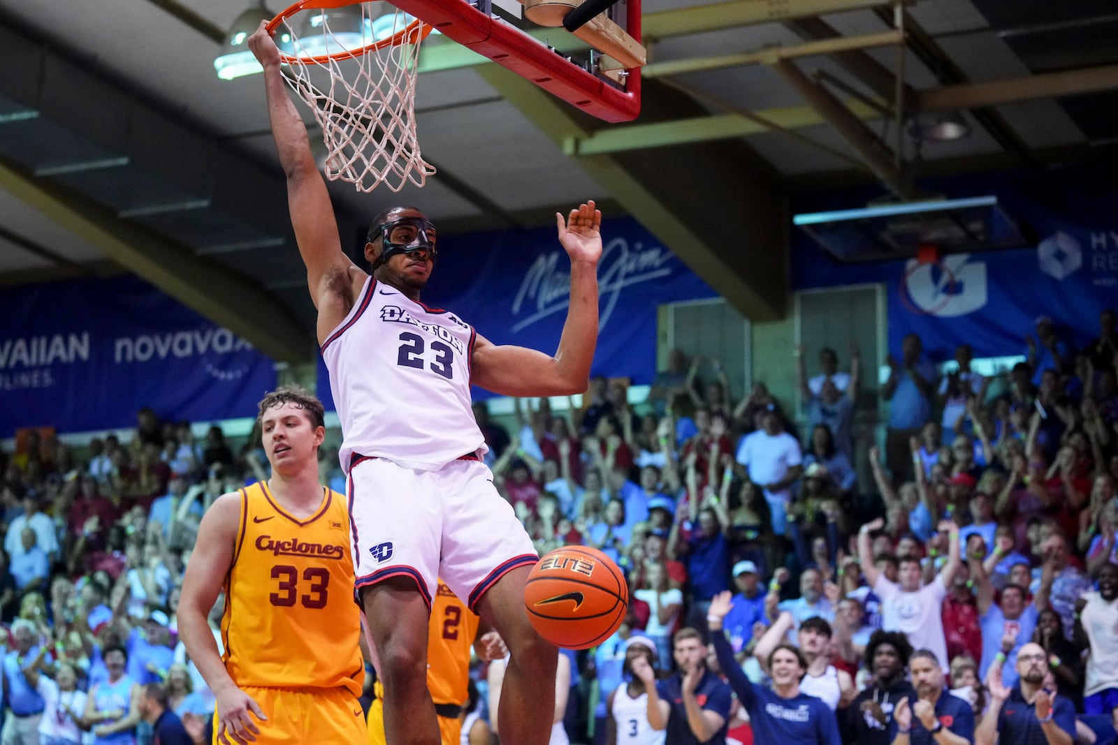 Dayton forward Zed Key (23) dunks against Iowa State forward Brandton Chatfield (33) during the second half of an NCAA college basketball game at the Maui Invitational Tuesday, Nov. 26, 2024, in Lahaina, Hawaii. Iowa State won 89-84. (AP Photo/Lindsey Wasson)