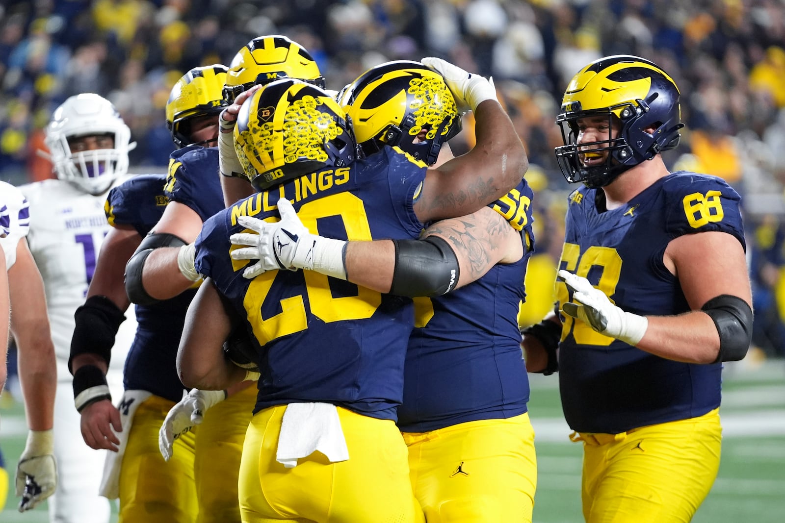 Michigan running back Kalel Mullings (20) celebrates his one-yard touchdown run in the second half of an NCAA college football game against Northwestern in Ann Arbor, Mich., Saturday, Nov. 23, 2024. (AP Photo/Paul Sancya)