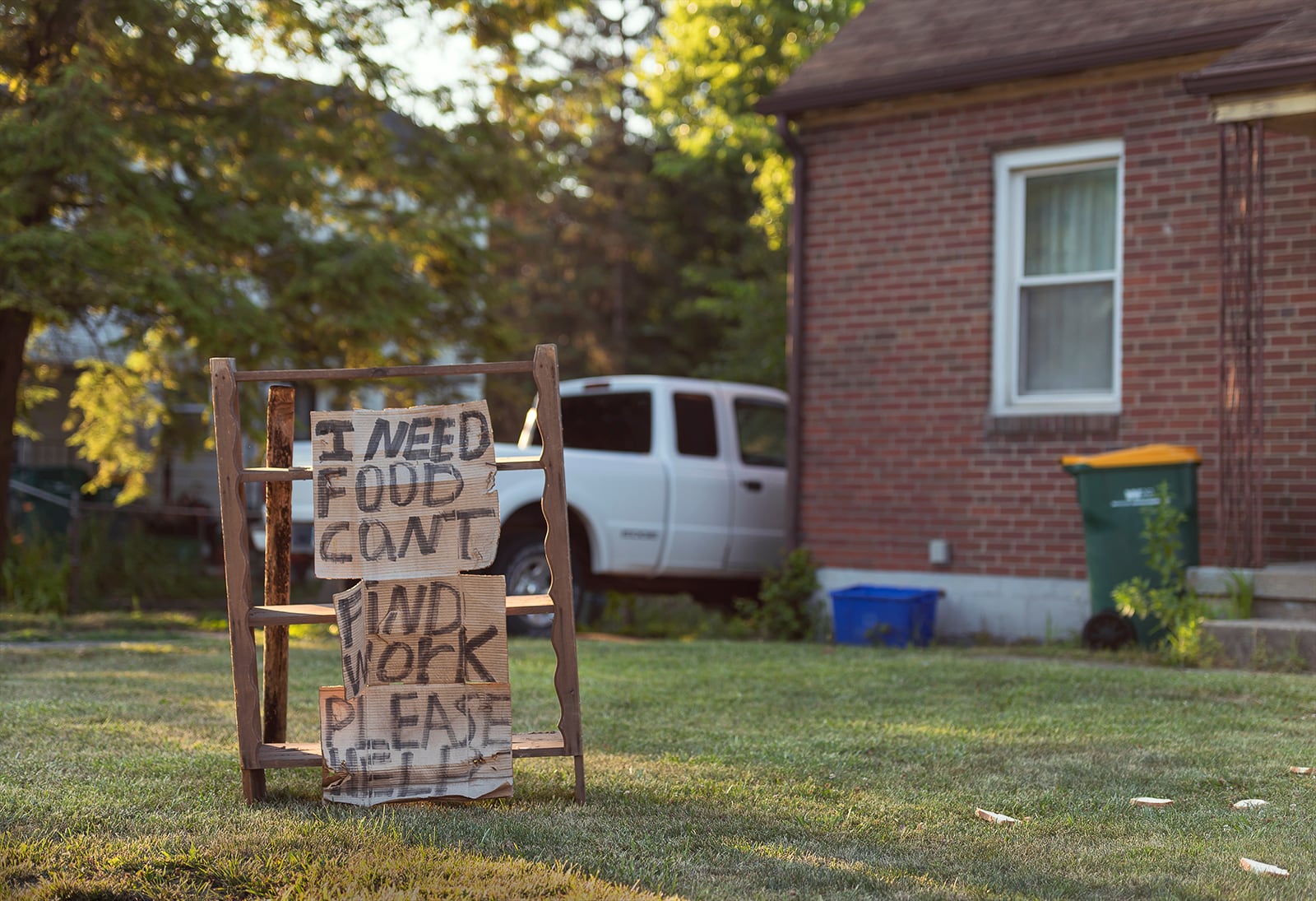 Matthew Helton: "Bread," one of the selected images highlighted in The Contemporary and Dayton Daily News collaboration "In the Balance: Reflections of Our Community During COVID." "The pandemic has affected this area with many people losing their jobs. Some, who are at a higher risk to be affected by this virus, are forced to find support throughout the community for help while others seek to provide goods and services to the community earning any type of income they can. A gentleman just out of frame in 'Bread' has made a sign asking his community for donations of food after losing his job. The images together reflect the different situations our society finds itself in struggle to find a way to get the necessities they need"