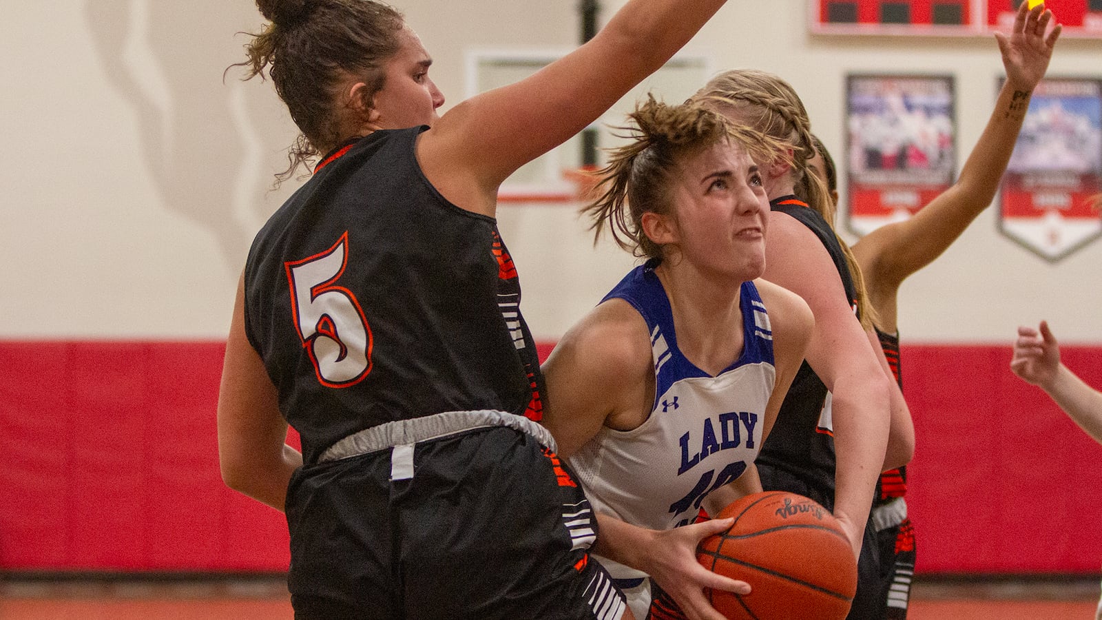 Miami East's McKayah Musselman tries to score against West Liberty-Salem's Chaley Wade during the second half of Friday's Division III tournament game at Northridge High School. Jeff Gilbert/CONTRIBUTED