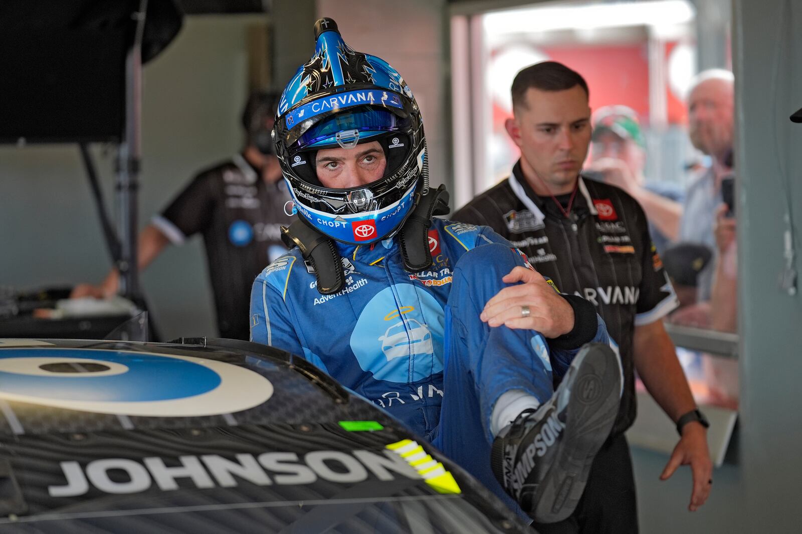 Jimmie Johnson climbs into his car during a practice for the NASCAR Daytona 500 auto race Saturday, Feb. 15, 2025, at Daytona International Speedway in Daytona Beach, Fla. (AP Photo/Chris O'Meara)