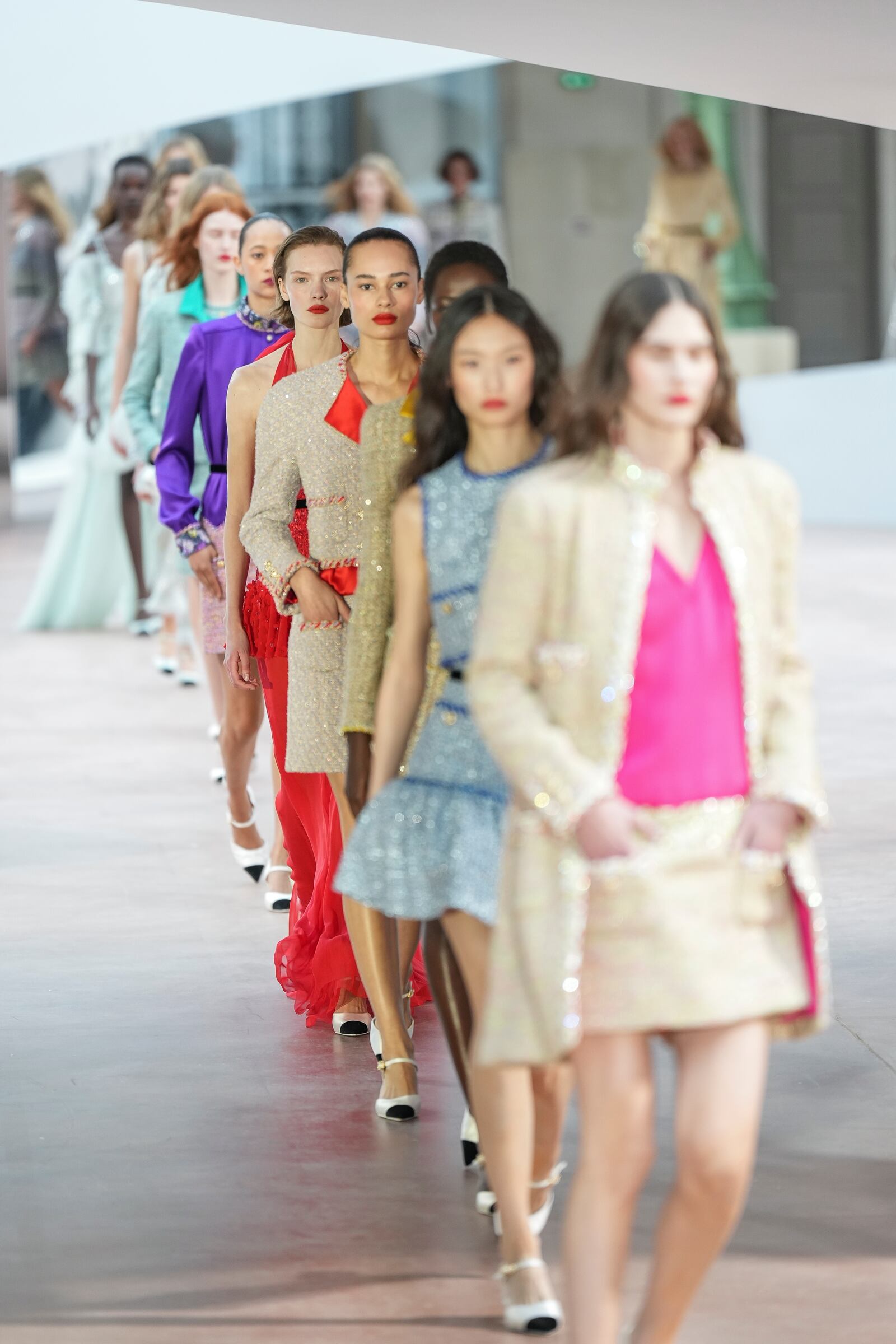 Models wear creations as part of the Chanel Haute Couture Spring Summer 2025 collection, that was presented in Paris, Tuesday, Jan. 28, 2025. (AP Photo/Lewis Joly).