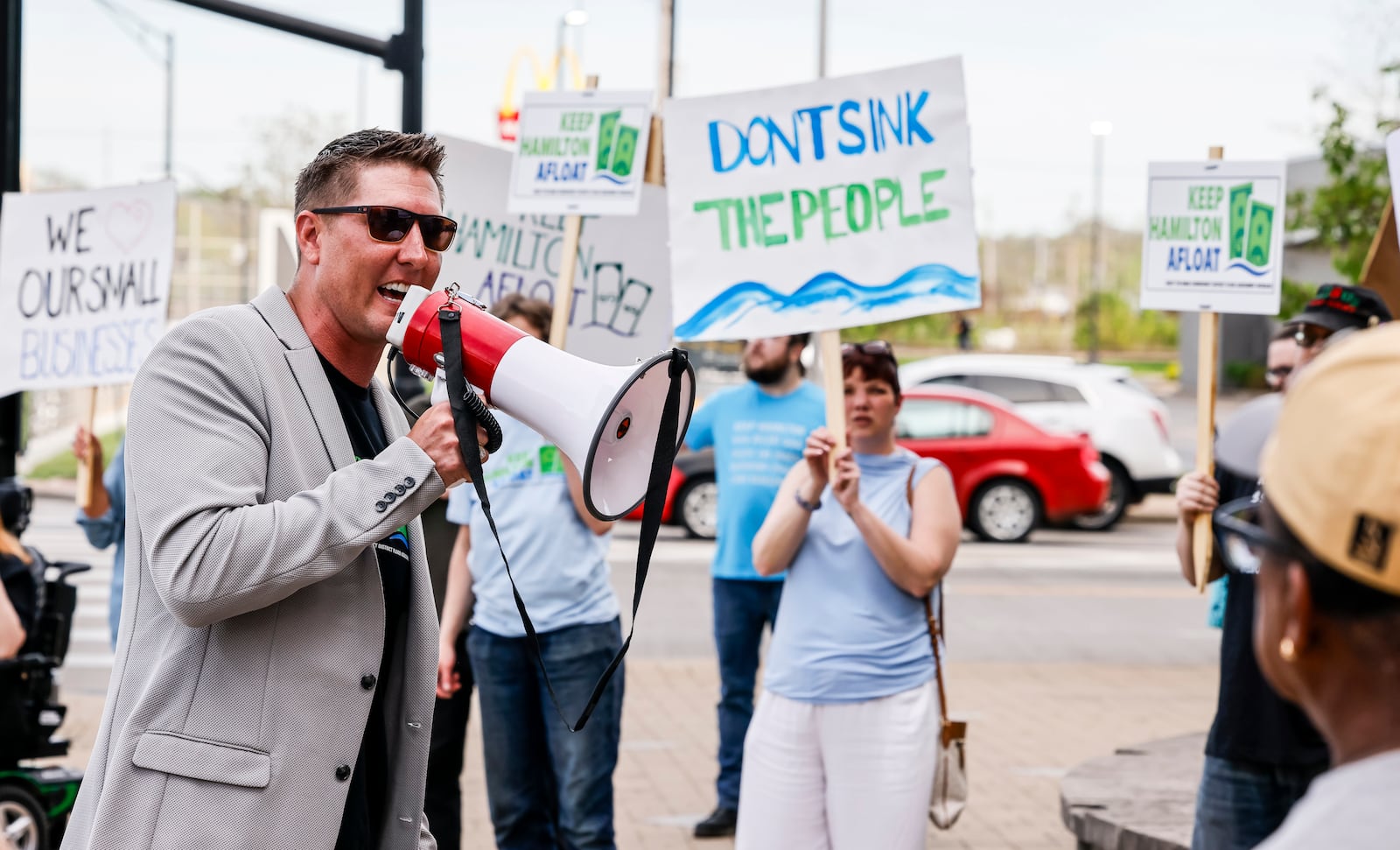 Concerned citizen David Stark leads a rally against the Miami Conservancy District assessment increase in front of the Hamilton Municpal Building before a special meeting to discuss the issue Thursday, April 18, 2024 in Hamilton. NICK GRAHAM/STAFF