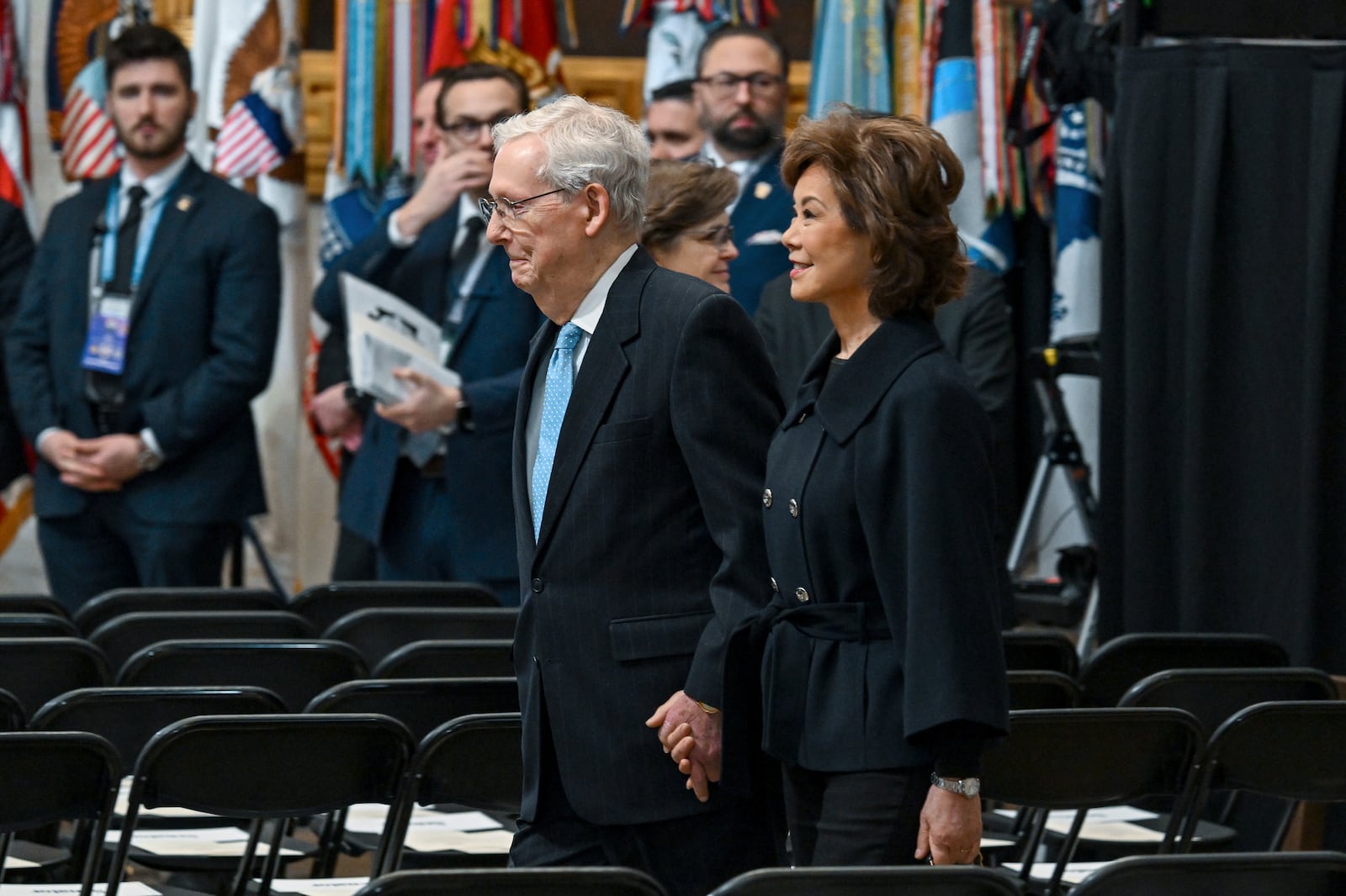 Senate Minority Leader Mitch McConnell, R-Ky., left, and his wife Elaine Chao arrive for the 60th Presidential Inauguration in the Rotunda of the U.S. Capitol in Washington, Monday, Jan. 20, 2025. (Kenny Holston/The New York Times via AP, Pool)