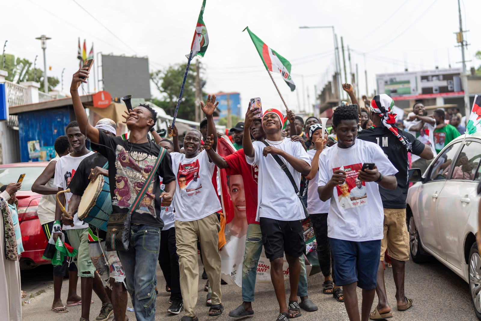 Supporters of opposition candidate and former President John Dramani Mahama celebrate his victory after his opponent Ghana’s vice president and ruling party candidate, Mahamudu Bawumia conceded in Accra, Ghana, Sunday, December 8, 2024. (AP Photo/Jerome Delay)