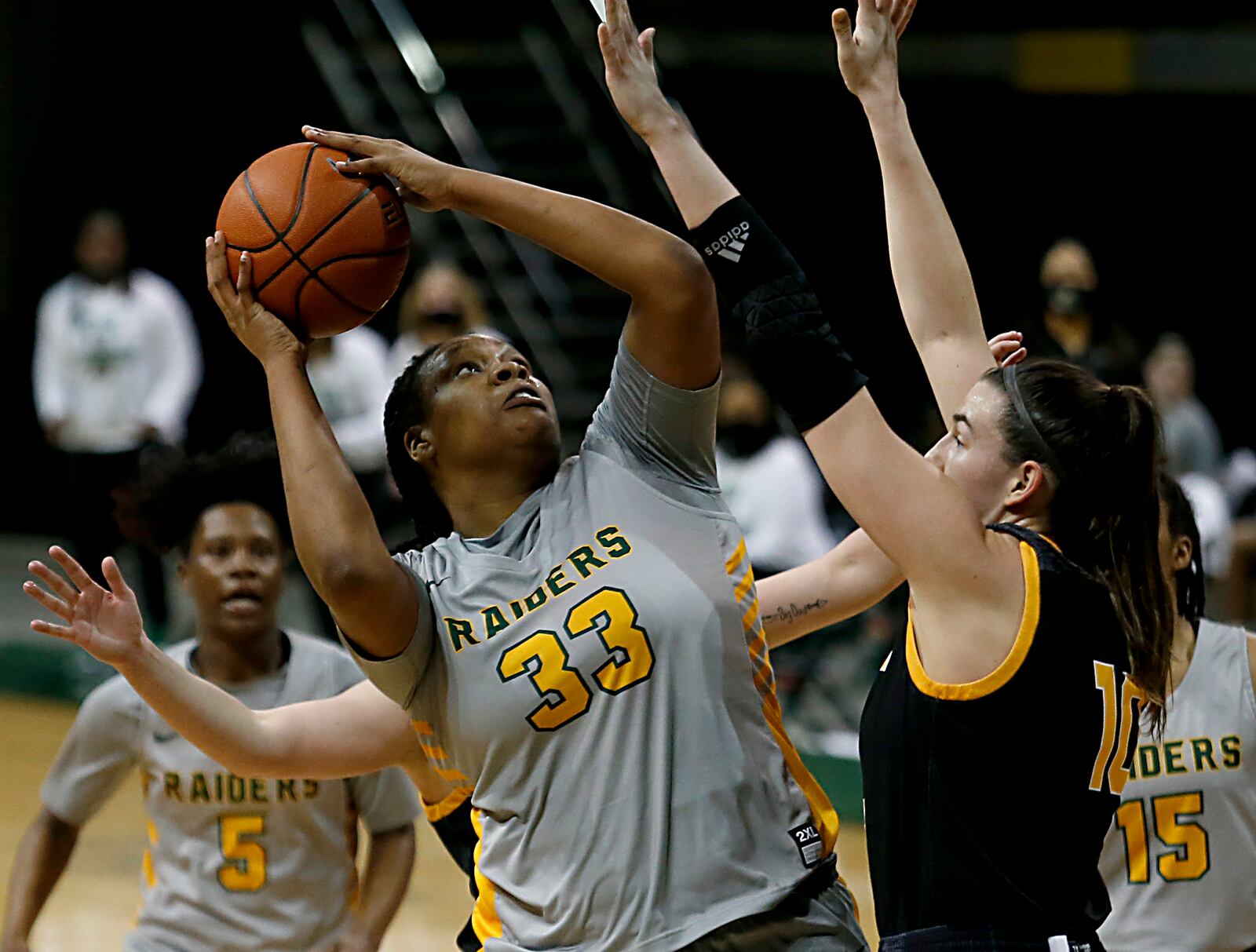 Wright State center Tyler Frierson scores on Northern Kentucky forward/center Grayson Rose during a Horizon League quarterfinal at the Nutter Center in Fairborn Mar. 2, 2021. Wright State won 74-56. E.L. Hubbard/CONTRIBUTED