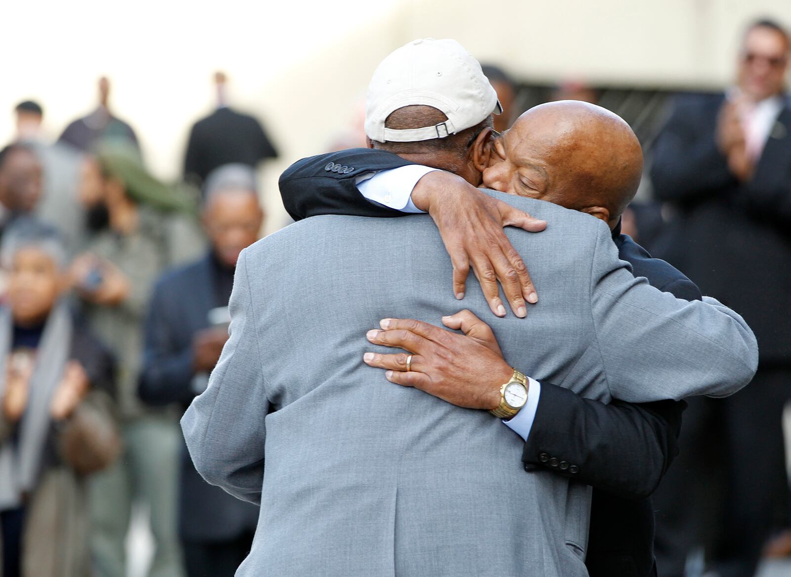 Archived photo: Civil right icon U.S. Rep. John Lewis (facing) embraces Dayton civil rights leader Jessie Gooding before a get out the vote rally at Sinclair Community College in Dayton Friday.  LISA POWELL / STAFF