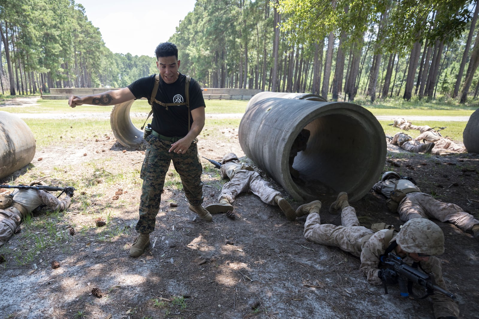 A U.S. Marine Corps tactical advisors trains a group of recruits during basic warrior training at the Marine Corps Recruit Depot, Wednesday, June 28, 2023, in Parris Island, S.C. (AP Photo/Stephen B. Morton)