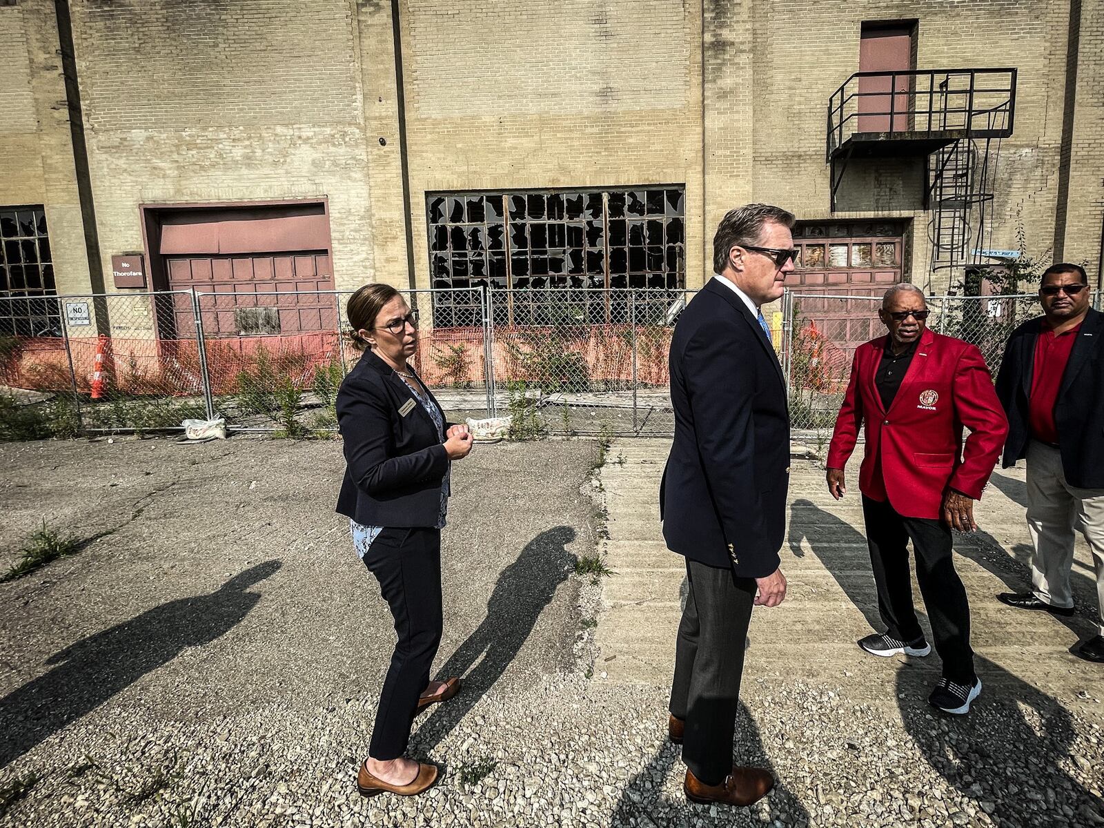 From left, Executive Director of the National Aviation Heritage Area Mackensie Wittmer, U.S. Rep. Mike Turner and Dayton Mayor Jeffery Mims Jr. tour the Wright Factory on West Third Street Tuesday August 1, 2023. JIM NOELKER/STAFF