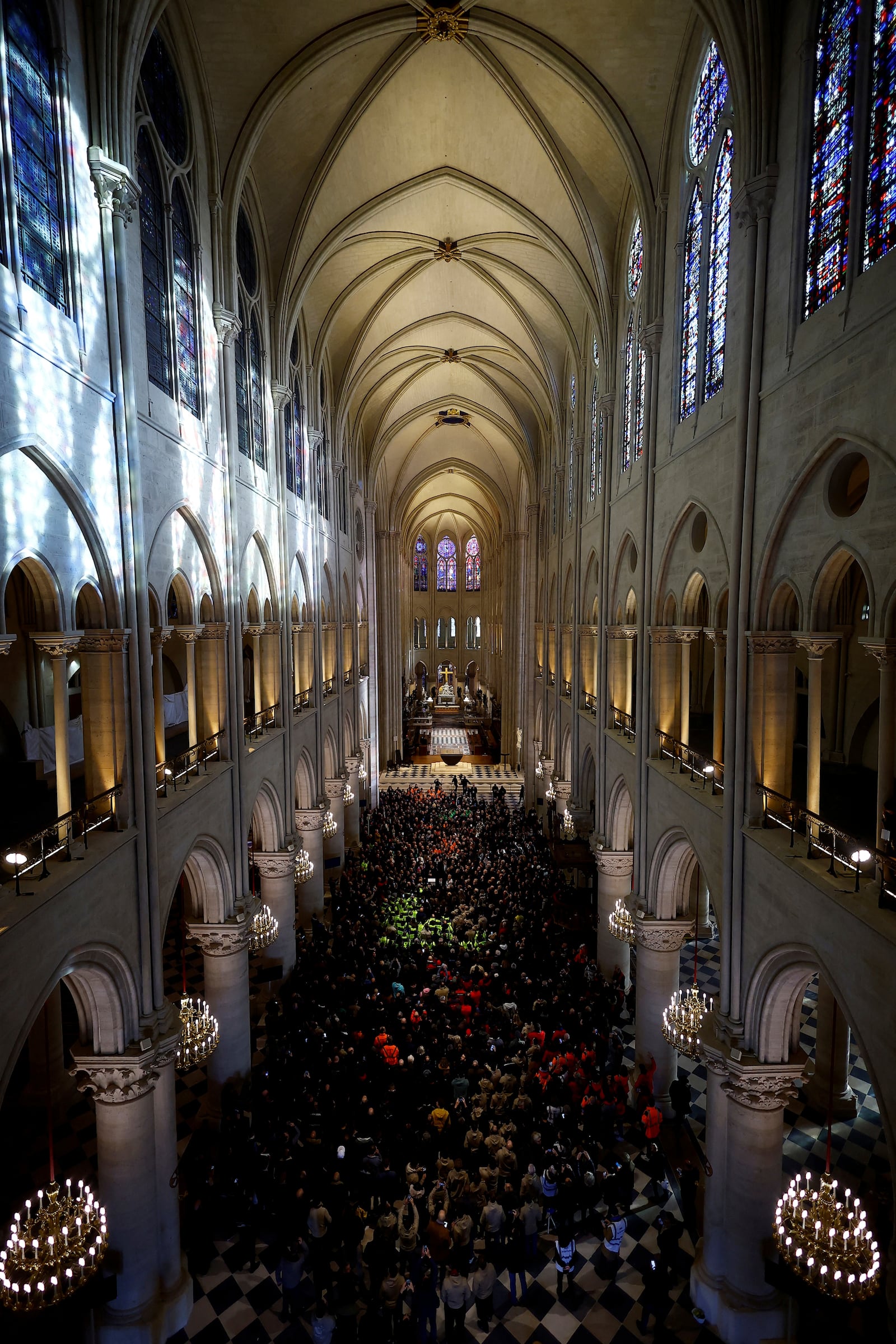 French President Emmanuel Macron delivers a speech to construction workers inside the Notre-Dame de Paris cathedral after visiting the restored interiors of the monument, Friday, Nov. 29, 2024 in Paris. (Sarah Meyssonnier/Pool via AP)