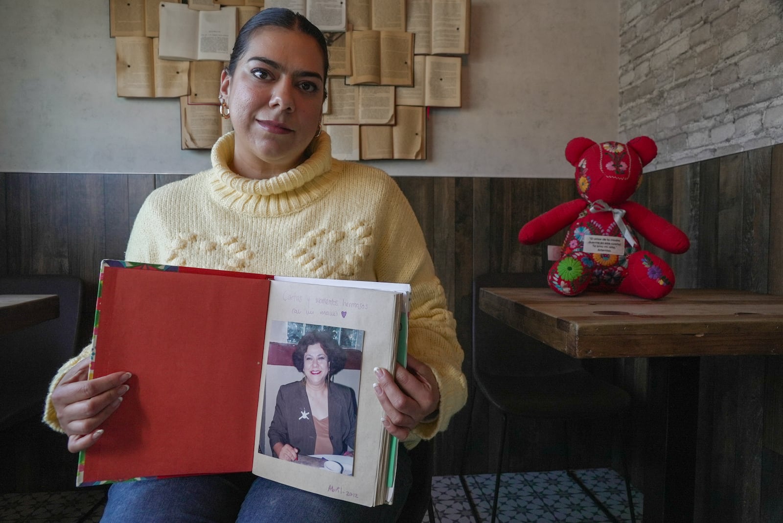 Artemisa Belmonte holds a photo of her mother, Artemisa Ibarra Rodriguez, during an interview in Ciudad Juarez, Mexico, Tuesday, Jan. 21, 2025. Belmonte, whose mother and three uncles disappeared in 2011, started a petition against the film Emilia Perez to stop film showings and awards. (AP Photo/Martin Silva)