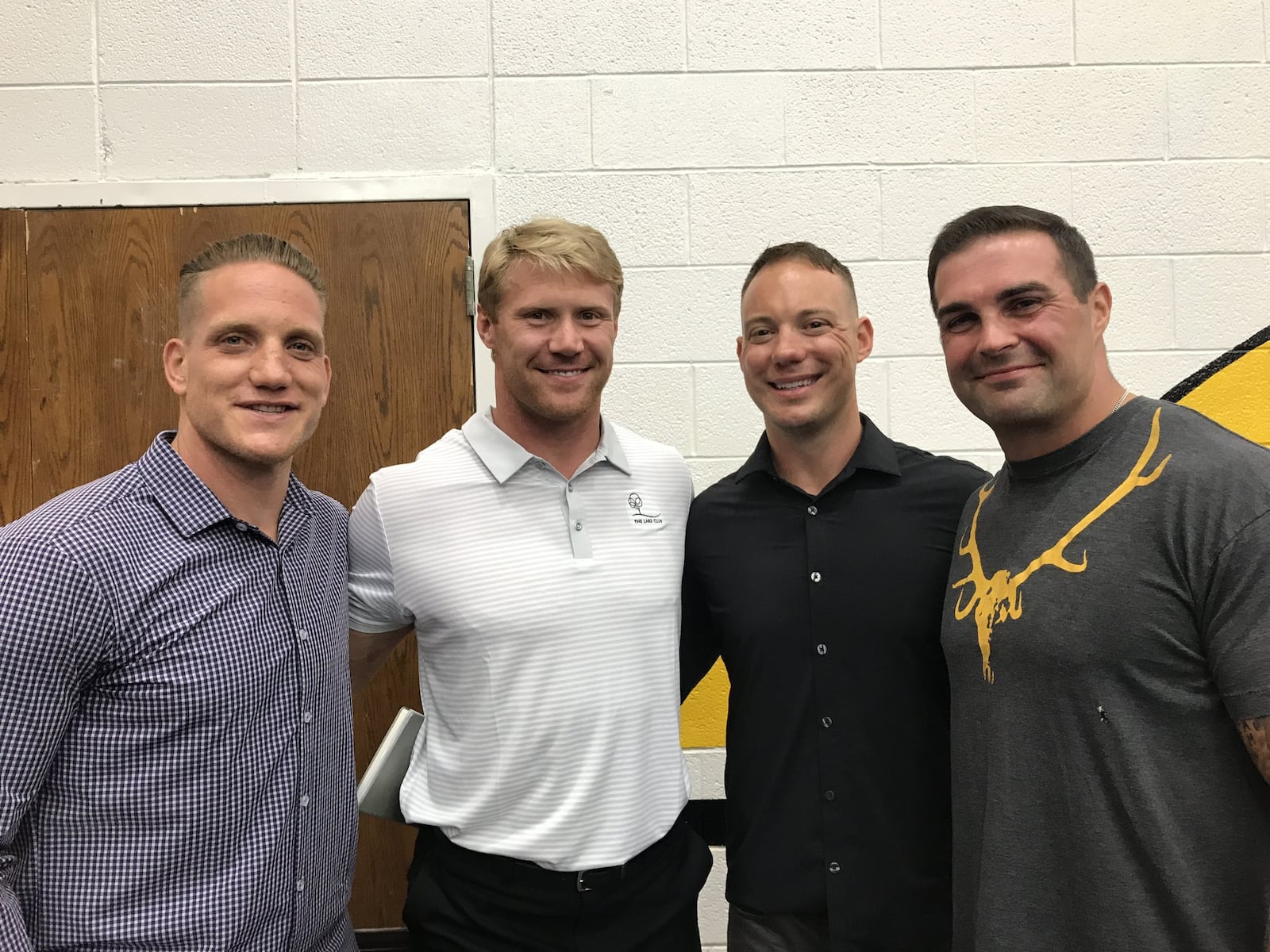 (From left) A.J. Hawk, Bobby Carpenter, Ryan Hawk and Anthony Schlegel on Monday night at the Sonny Unger Foundation Banquet. STAFF/MARCUS HARTMAN