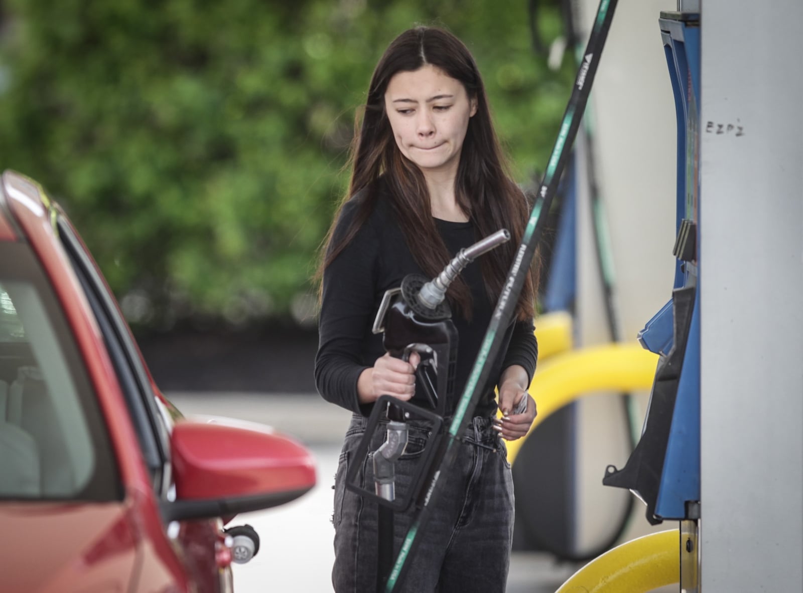 University of Dayton student Sophia Ante fills up her tank on Brown Street Thursday, May 6, 2021. A boost in travel for the summer and shortage of tanker truck drivers could cause some spot shortages over the summer. JIM NOELKER/STAFF