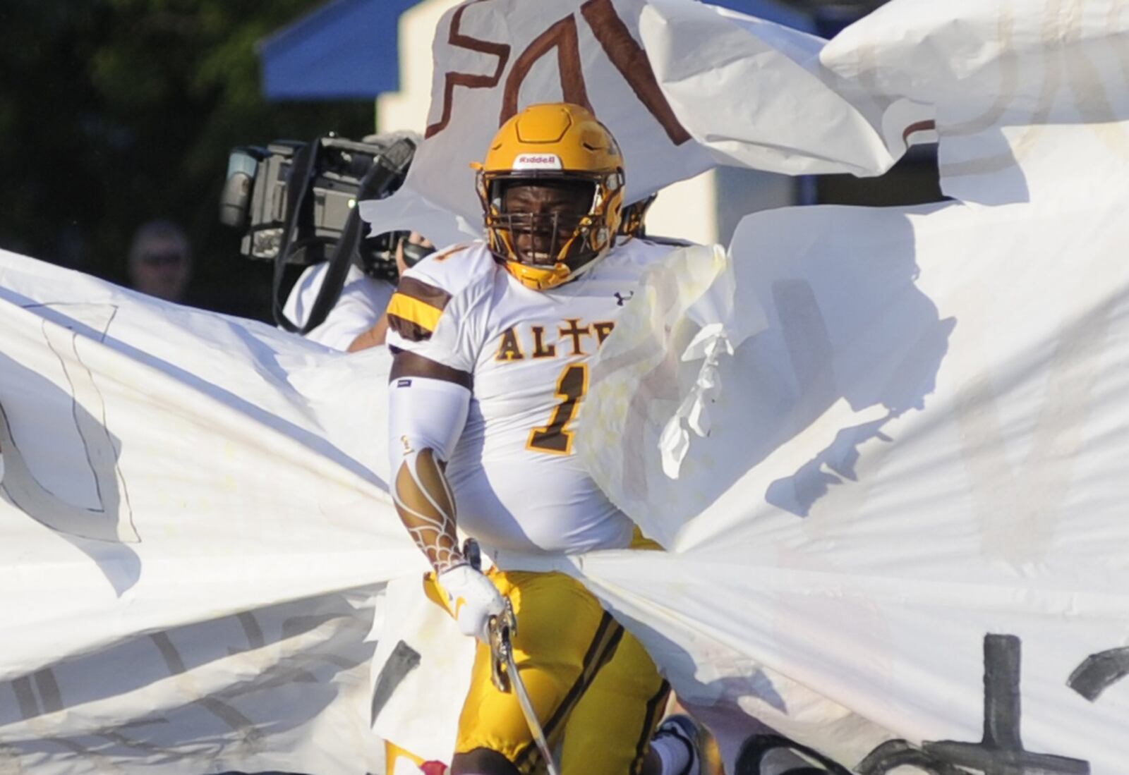 Alter senior defensive lineman “Cookie” Armstrong leads the Knights onto the field. Fairmont defeated visiting Alter 12-6 in a season-opening high school football game at Roush Stadium in Kettering on Thursday, Aug. 23, 2018. MARC PENDLETON / STAFF