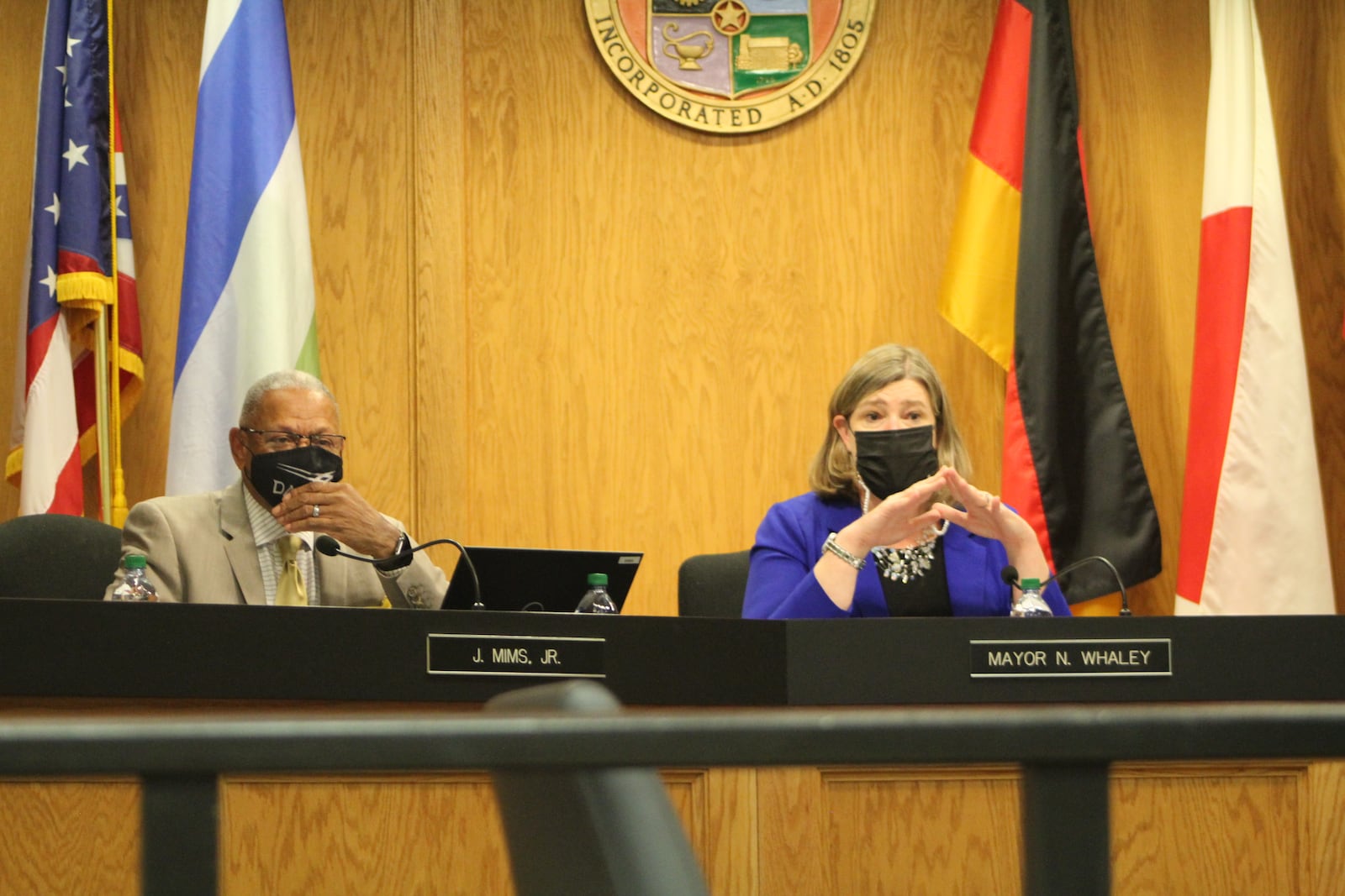 Dayton Mayor Nan Whaley and Mayor-elect Jeff Mims at Wednesday's city commission meeting, which was Whaley's last as mayor. CORNELIUS FROLIK / STAFF