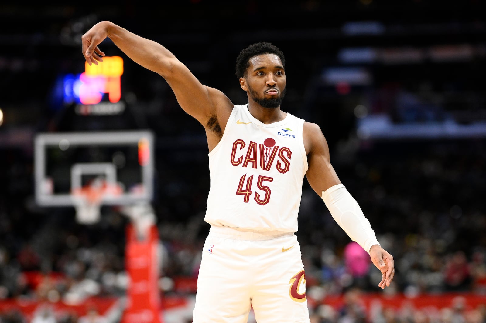 Cleveland Cavaliers guard Donovan Mitchell looks at the crowd after he made a 3-point basket during the first half of an NBA basketball game against the Washington Wizards, Friday, Feb. 7, 2025, in Washington. (AP Photo/Nick Wass)