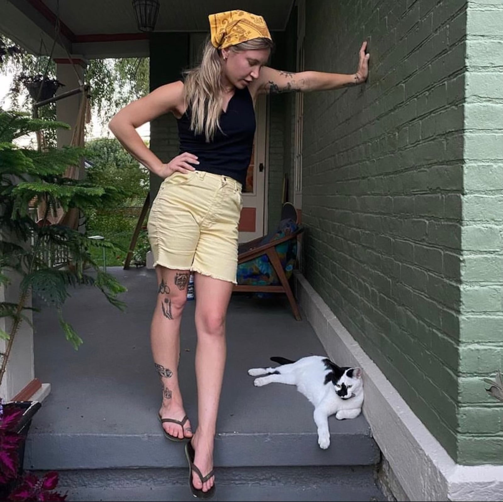 Artist Ashley Speelman with Coconut Kitty at home in South Park. "He is very prolific in the neighborhood, a local celebrity. People leave treats on my doorstep for him." Speelman recently showed at Skylab Gallery in Columbus with her artist collective, Flood Craft.