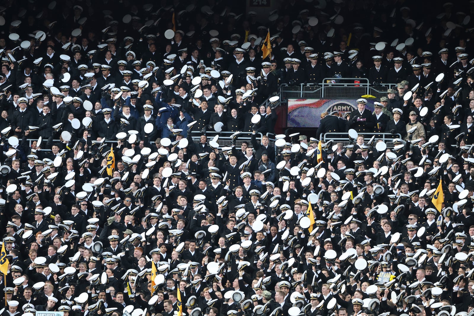 Midshipmen celebrate during the first half of an NCAA college football game against Army, Saturday, Dec. 14, 2024, in Landover, Md. (AP Photo/Daniel Kucin Jr.)