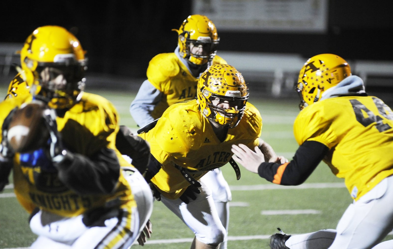 Alter senior Connor Meyer (center) is carrying on a family tradition with the Knights. Alter prepares for Wapakoneta during a practice on Wednesday, Nov. 14, 2018. MARC PENDLETON / STAFF